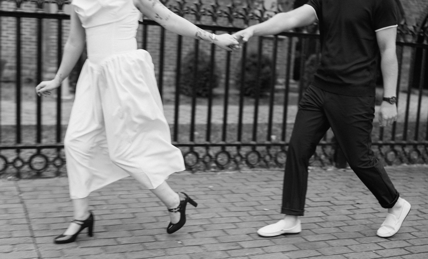 A black and white photo sequence shows someone jumping in front of an ornate iron gate.