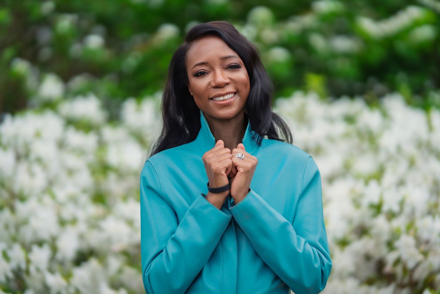 Atlanta personal branding photography for a life coach outdoors in a flower garden – Holland House Studio