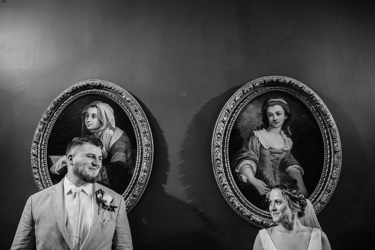 Dramatic black and white portraits framed in ornate circular frames.