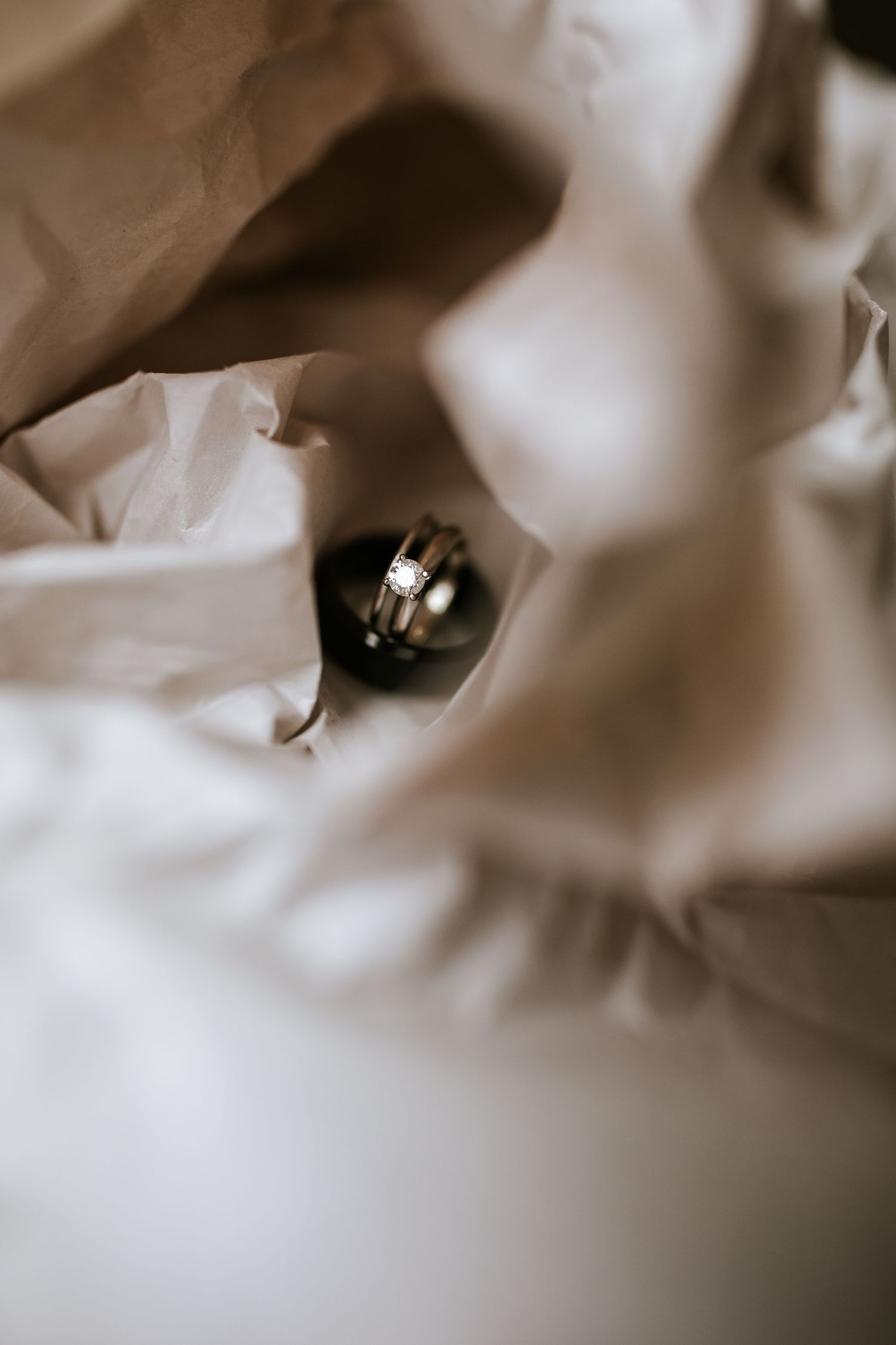 Abstract macro photography of wedding dress fabric details in sepia tones.
