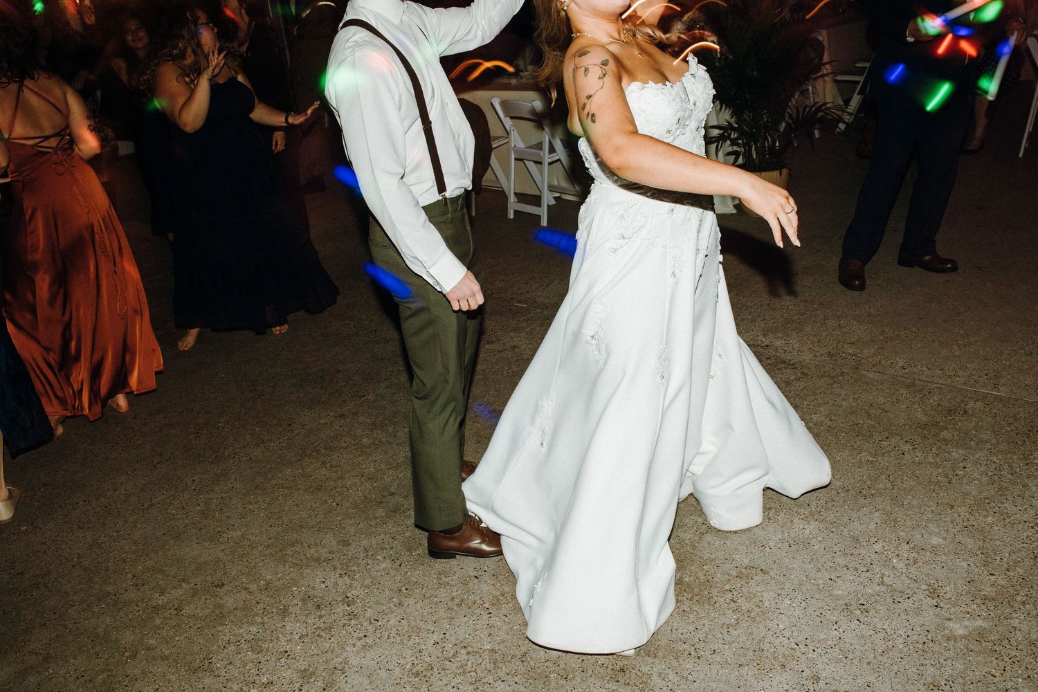 Wedding reception dance floor filled with guests enjoying the celebration.