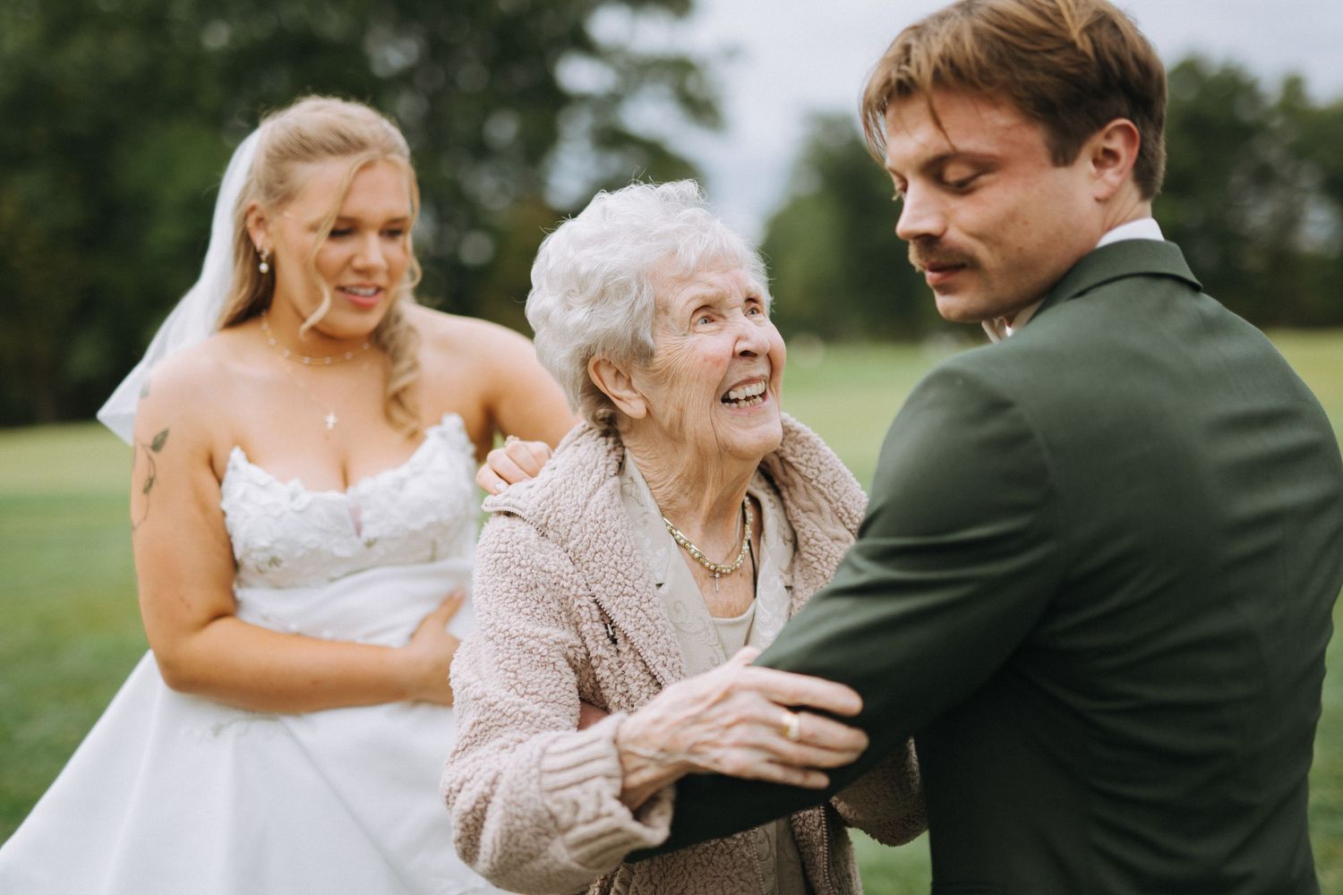 Emotional moments shared during outdoor wedding ceremony.