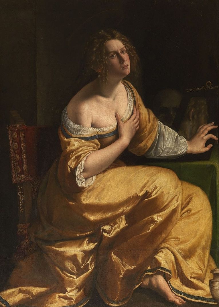 Classical oil painting of a woman in a golden dress reclining against green furniture.