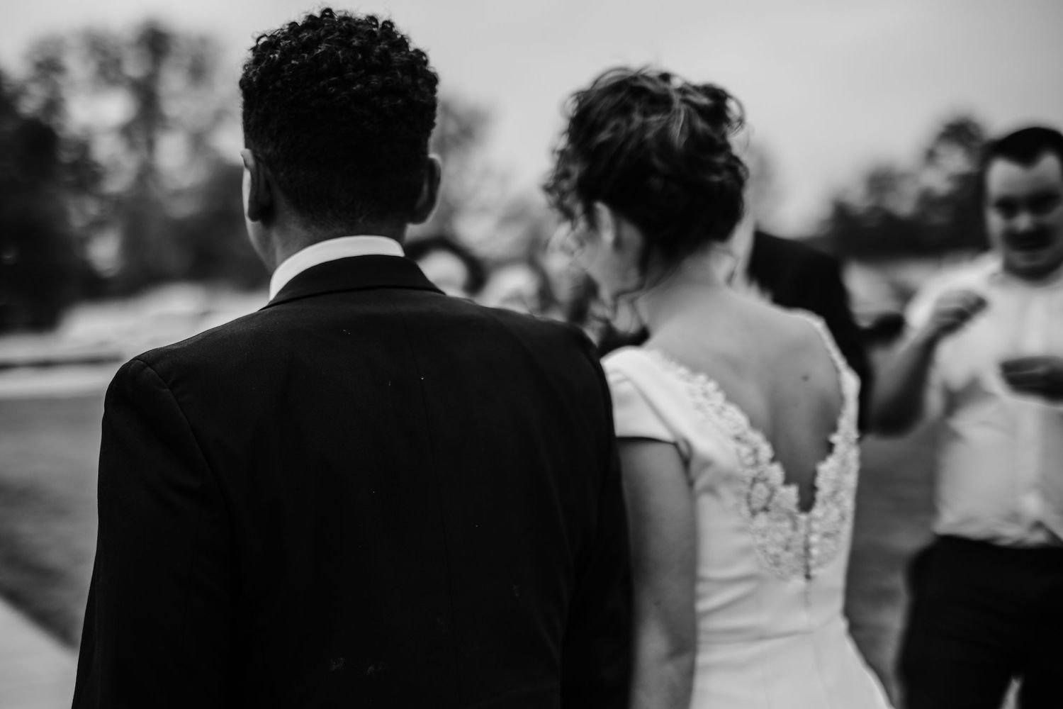 Black and white candid shots of wedding reception moments.
