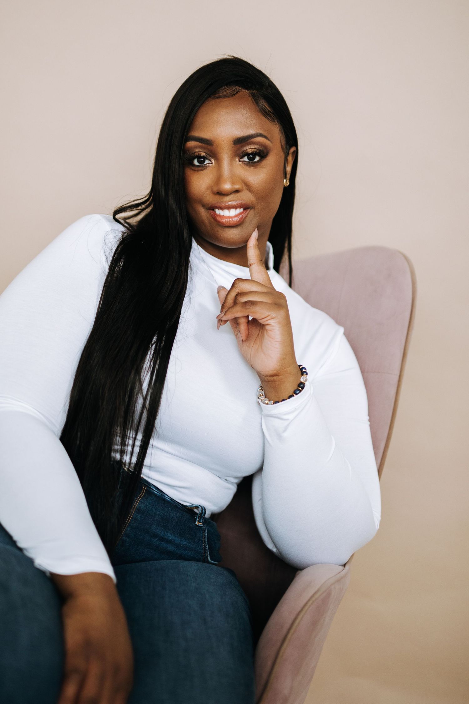 Professional fashion portrait series showing poses in white top and dark pants against neutral background.