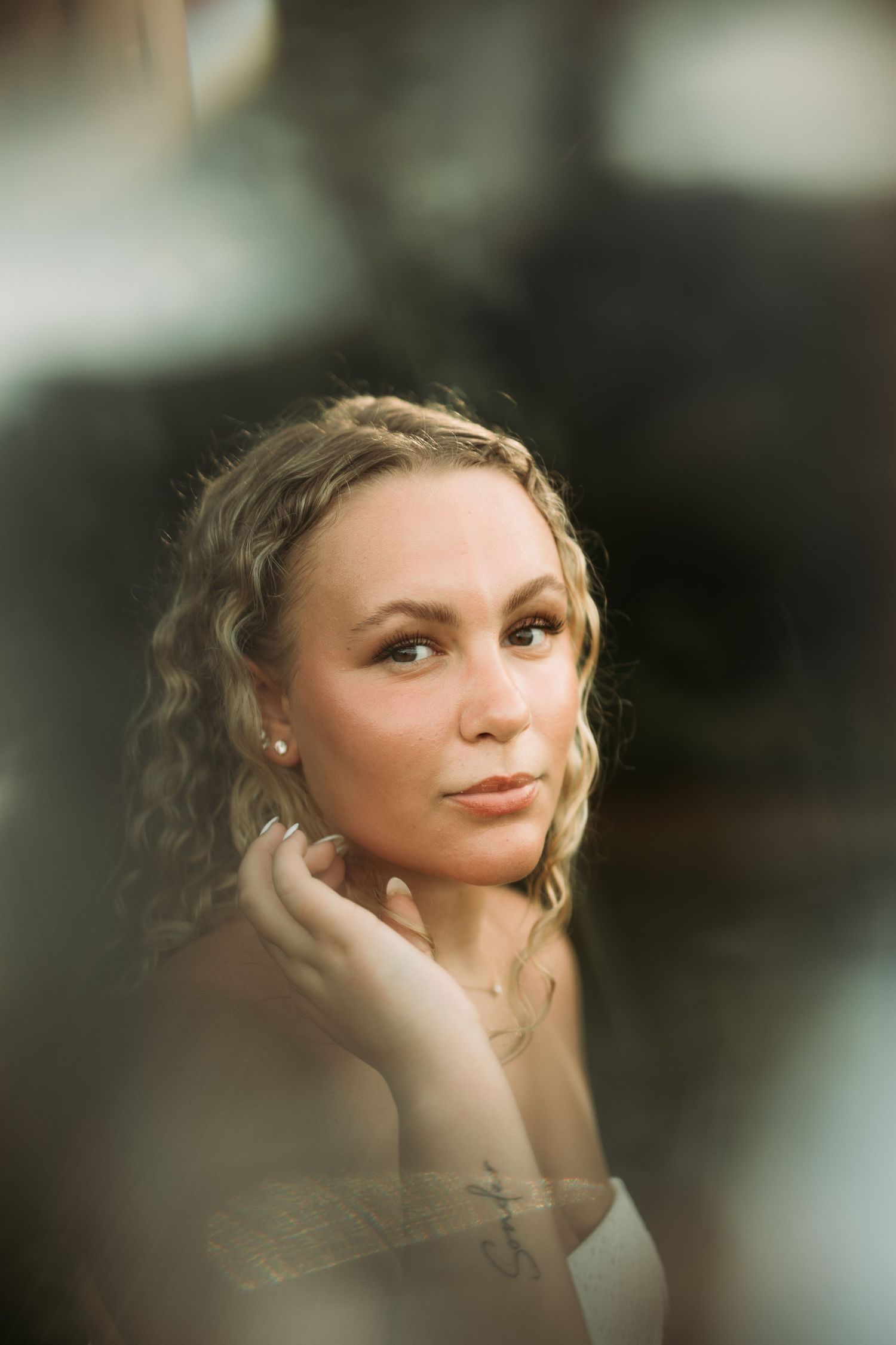 Dreamy portrait with soft focus and natural lighting creating an ethereal mood.