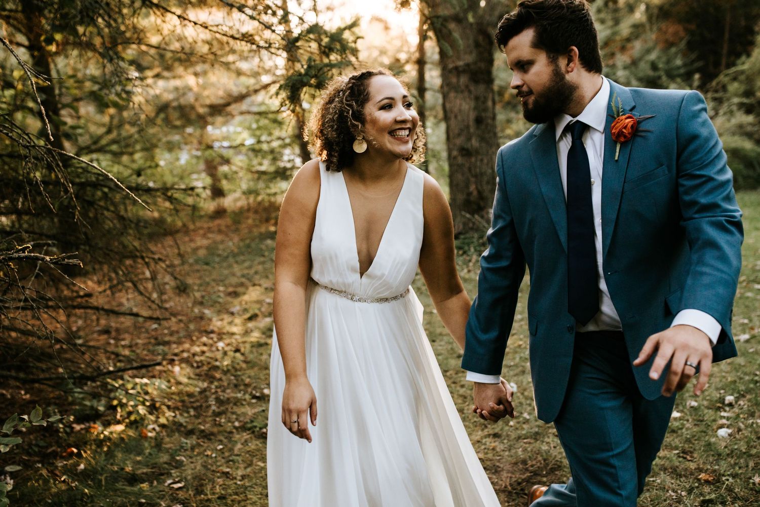 Candid wedding couple portraits in a natural outdoor setting.