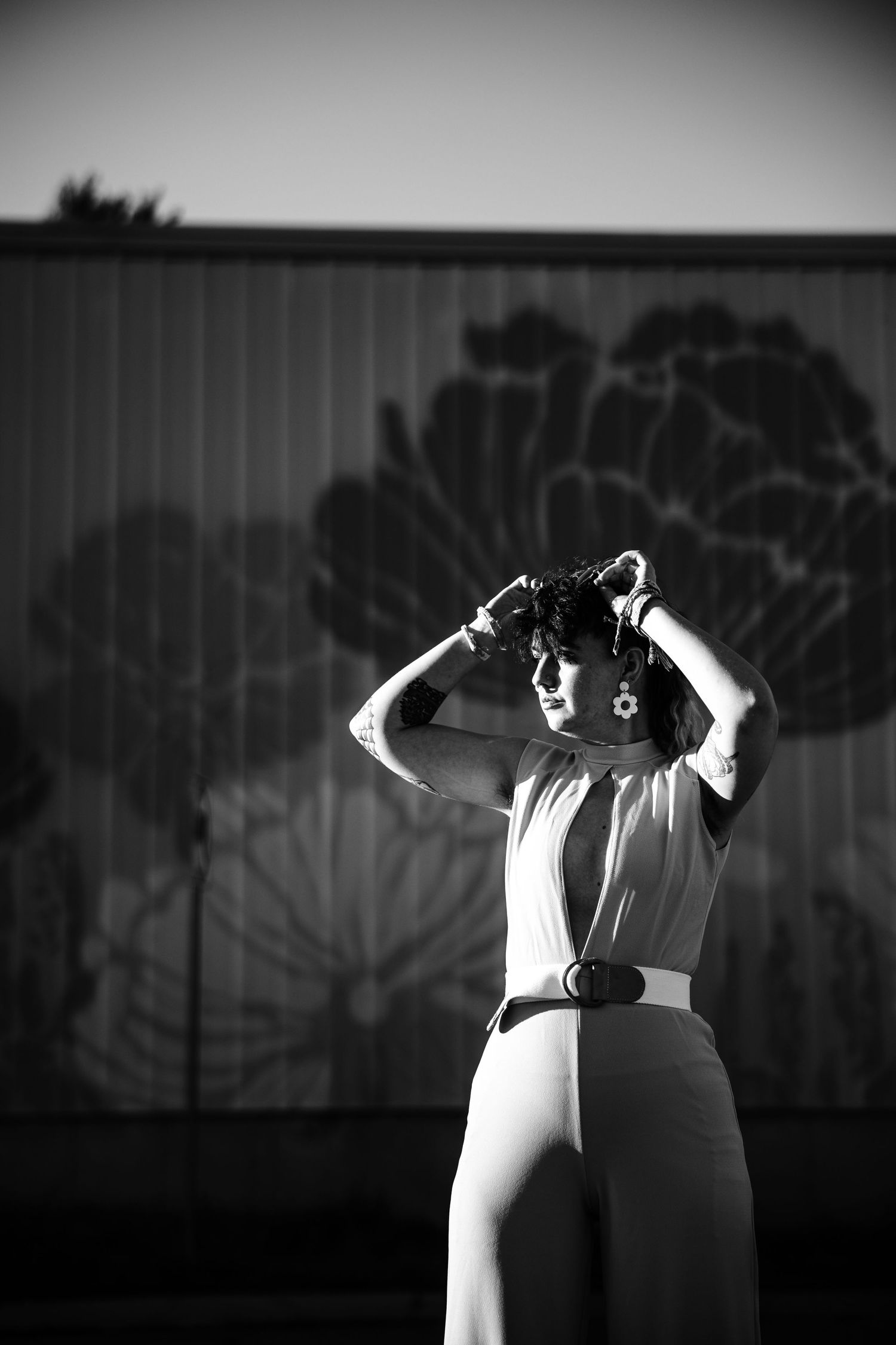 A black and white dance performance sequence showing graceful movement against a dark background with dramatic lighting.