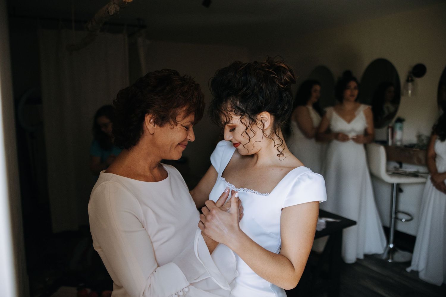 Wedding preparation moments captured in intimate black and white photography.