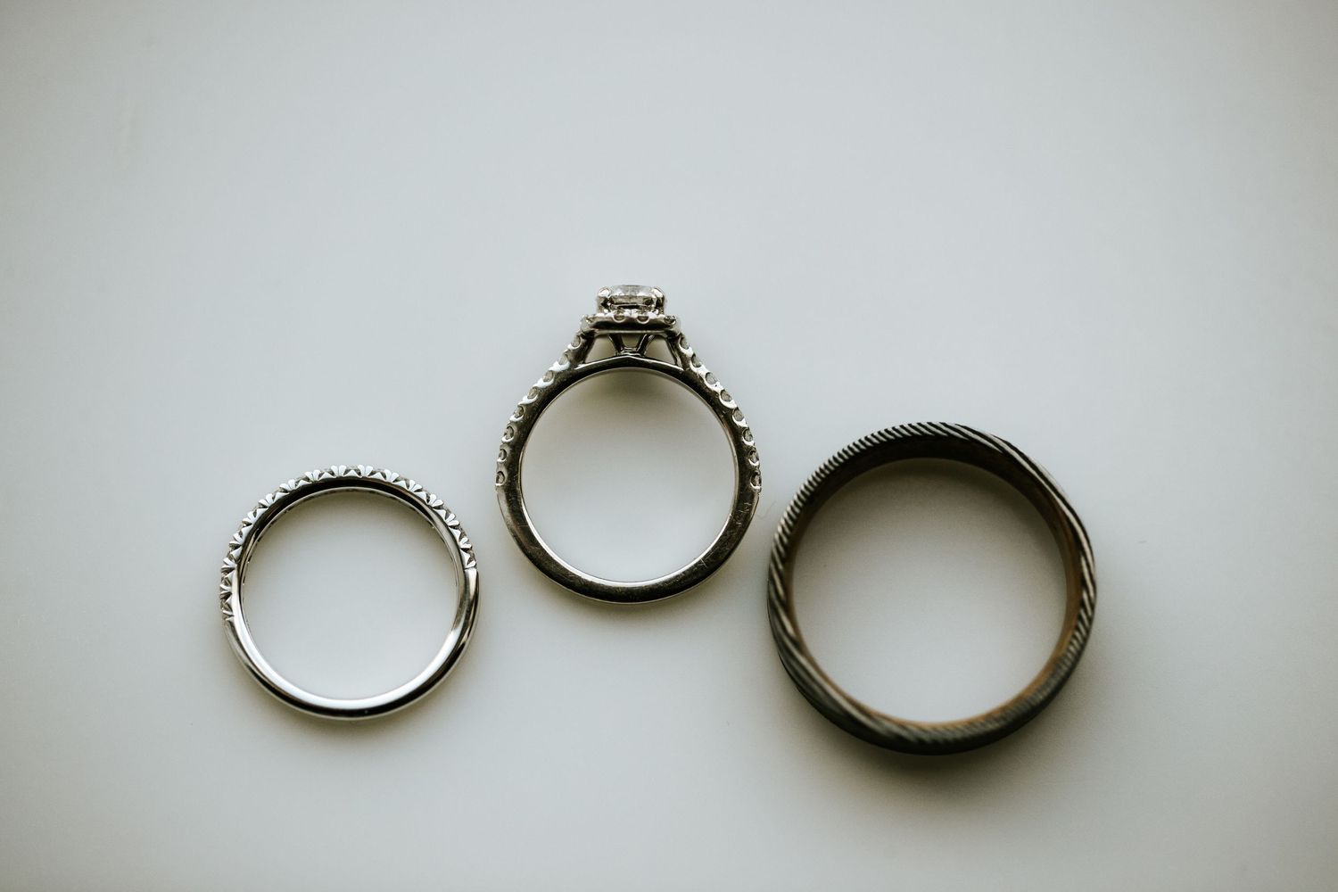 A series of seven images showing the progression of a ring being split into two separate bands.