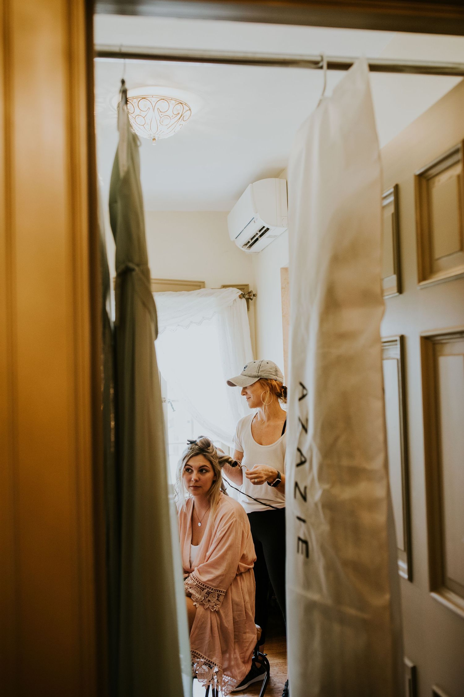Getting ready room with mirrors and soft lighting showing wedding day preparations.