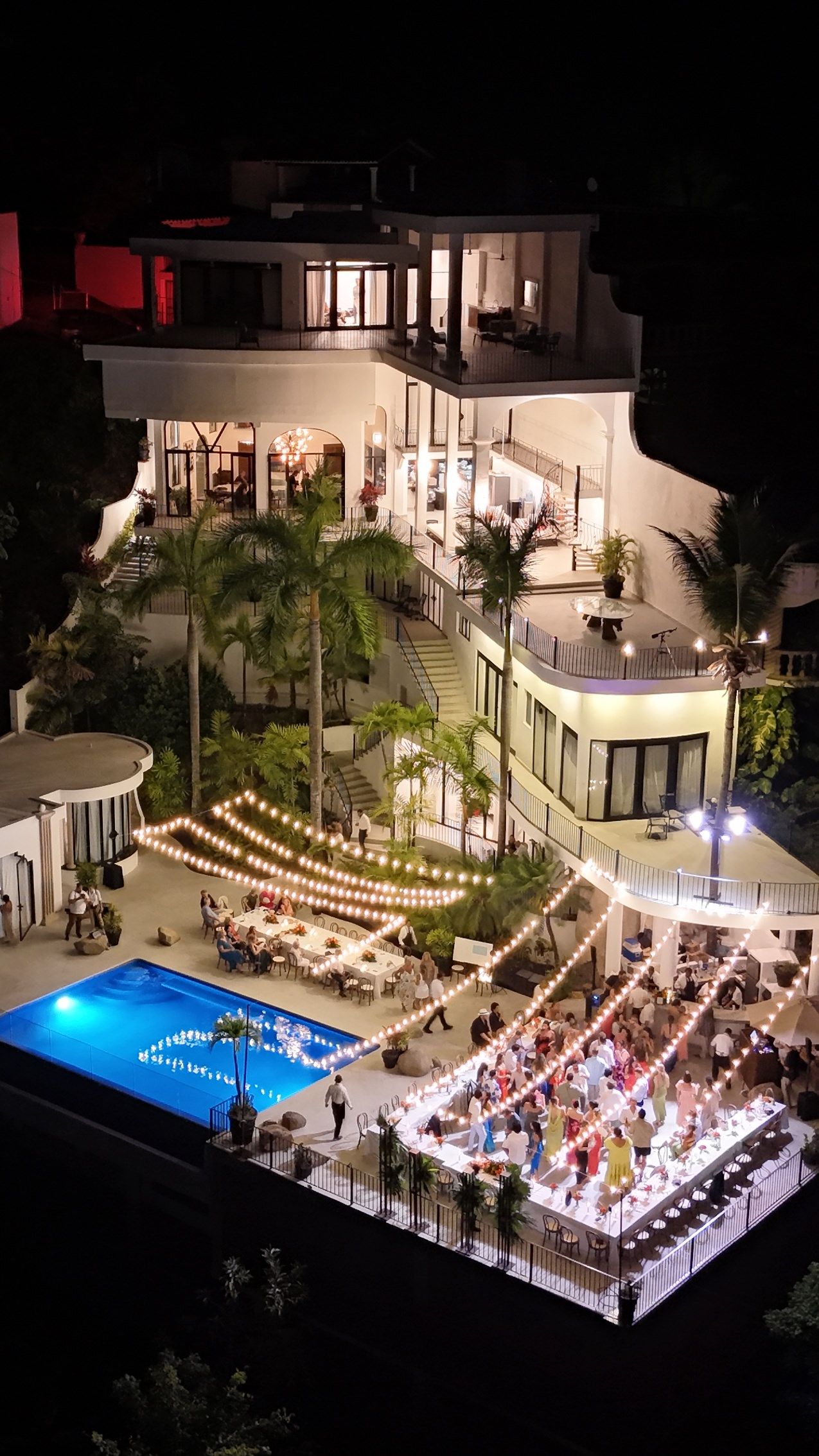 luxury wedding reception villa at night in Puerto Vallarta Mexico with lights and guests captured by wedding content creator experience!