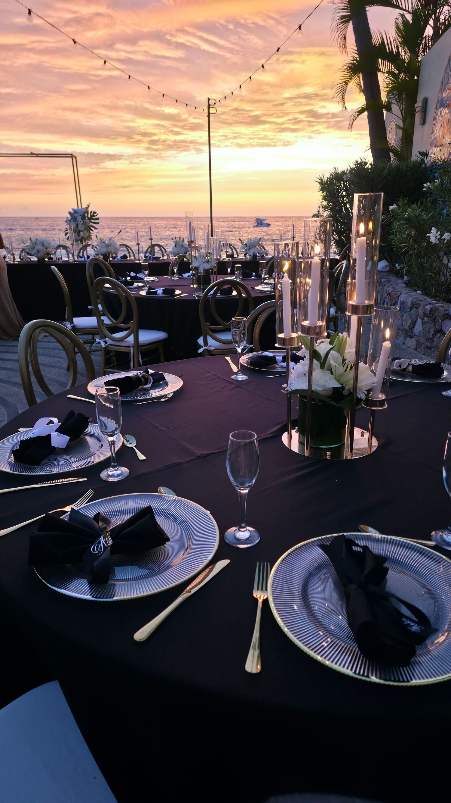 luxury wedding table setting with candles at sunset in Puerto Vallarta Mexico captured by wedding content creator romantic reception setup!