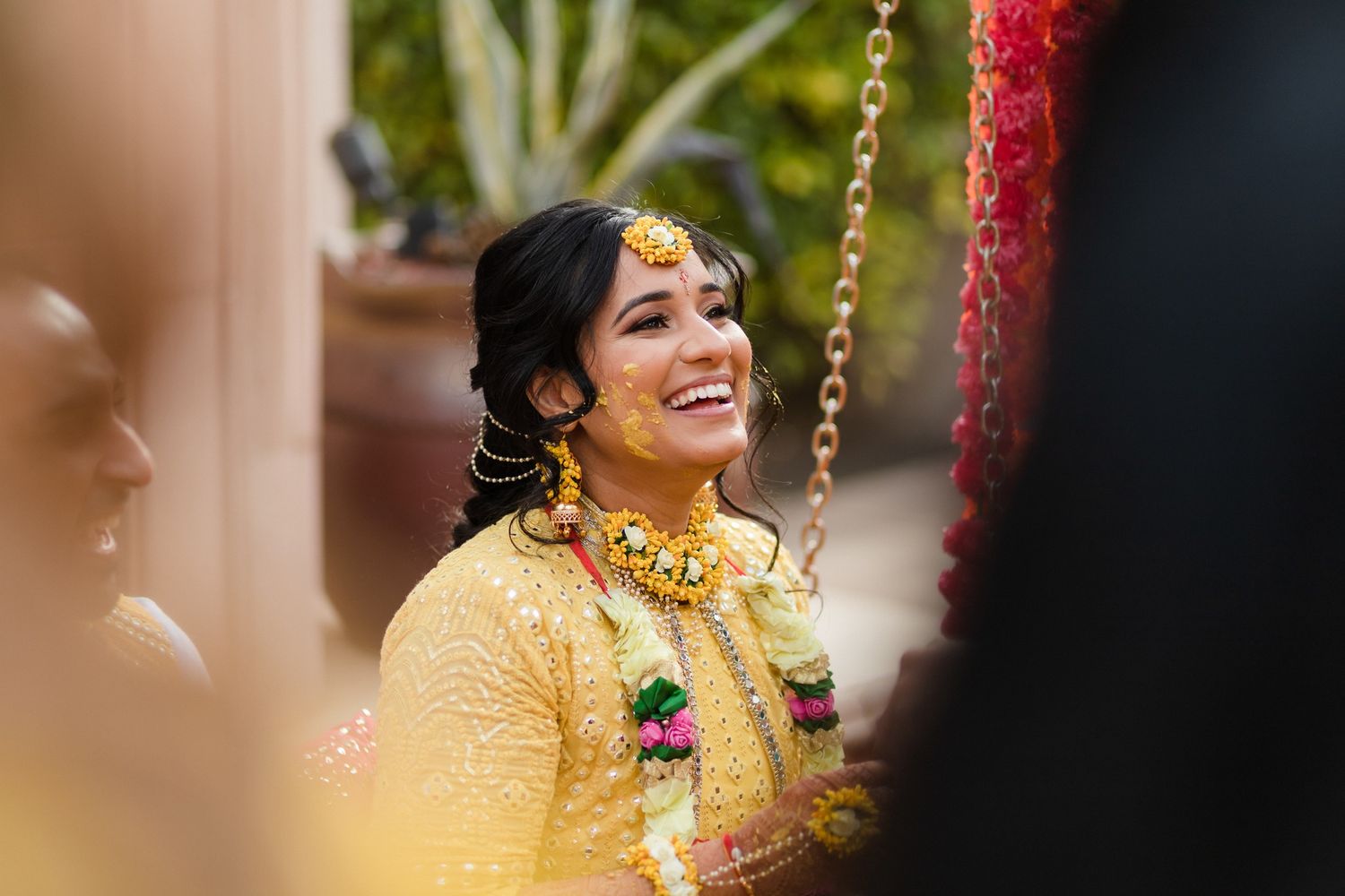 indian wedding haldi ceremony bride smiling during celebration in Puerto Vallarta Mexico captured by wedding content creator real moments!