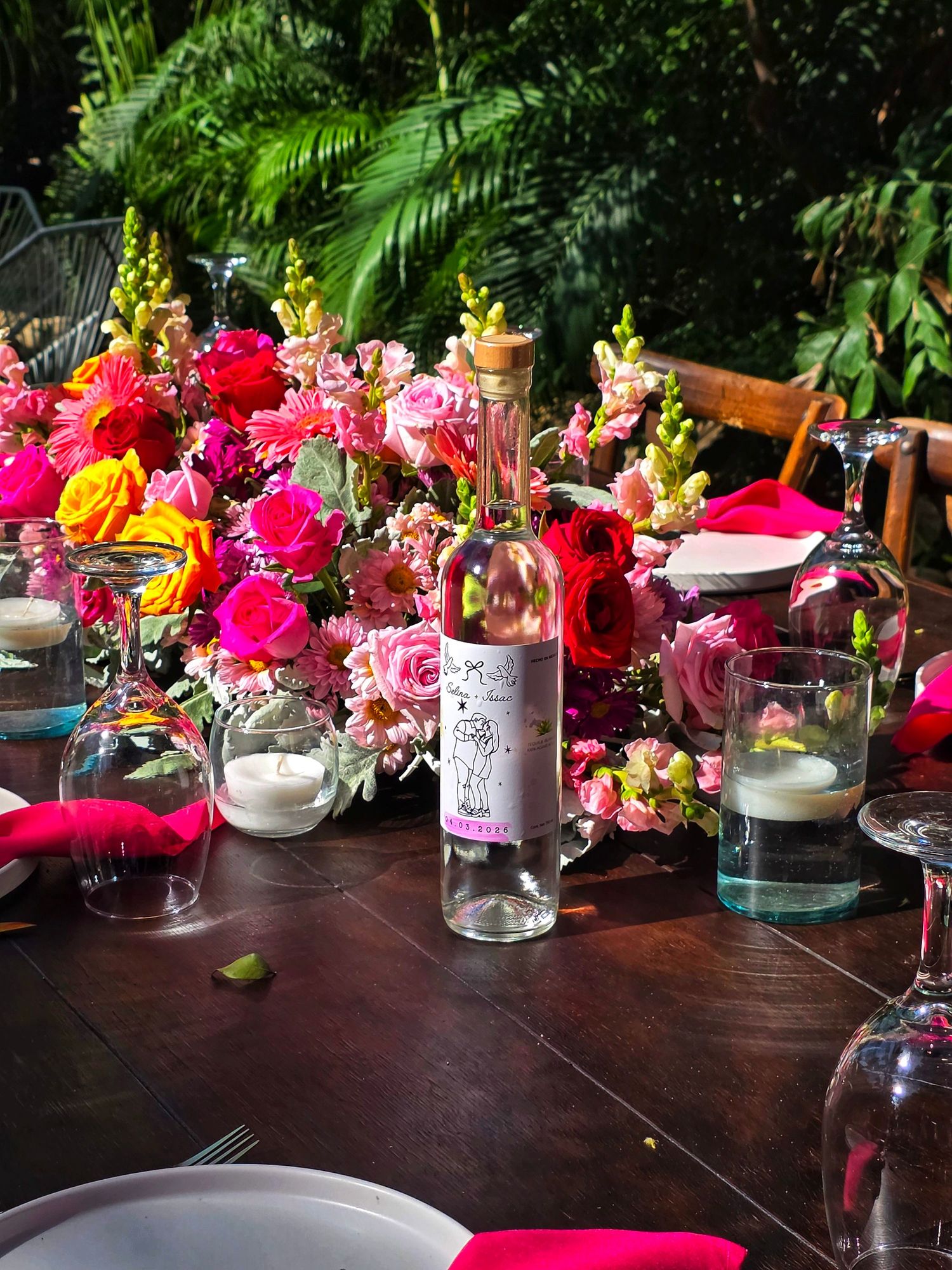 luxury wedding table with colorful flowers and decor in Puerto Vallarta Mexico captured by wedding content creator reception details!
