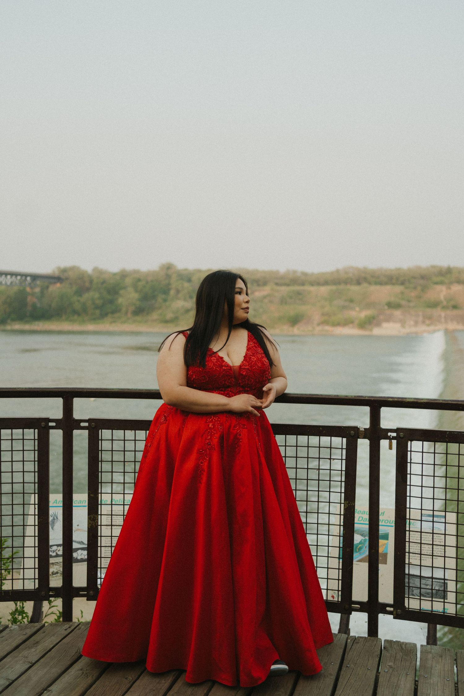 A graduate wears a red dress