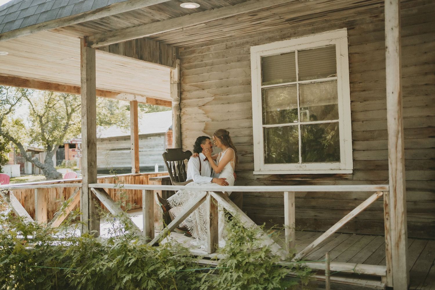 A newly wedded couple sharing a quiet and candid moment at their wedding venue