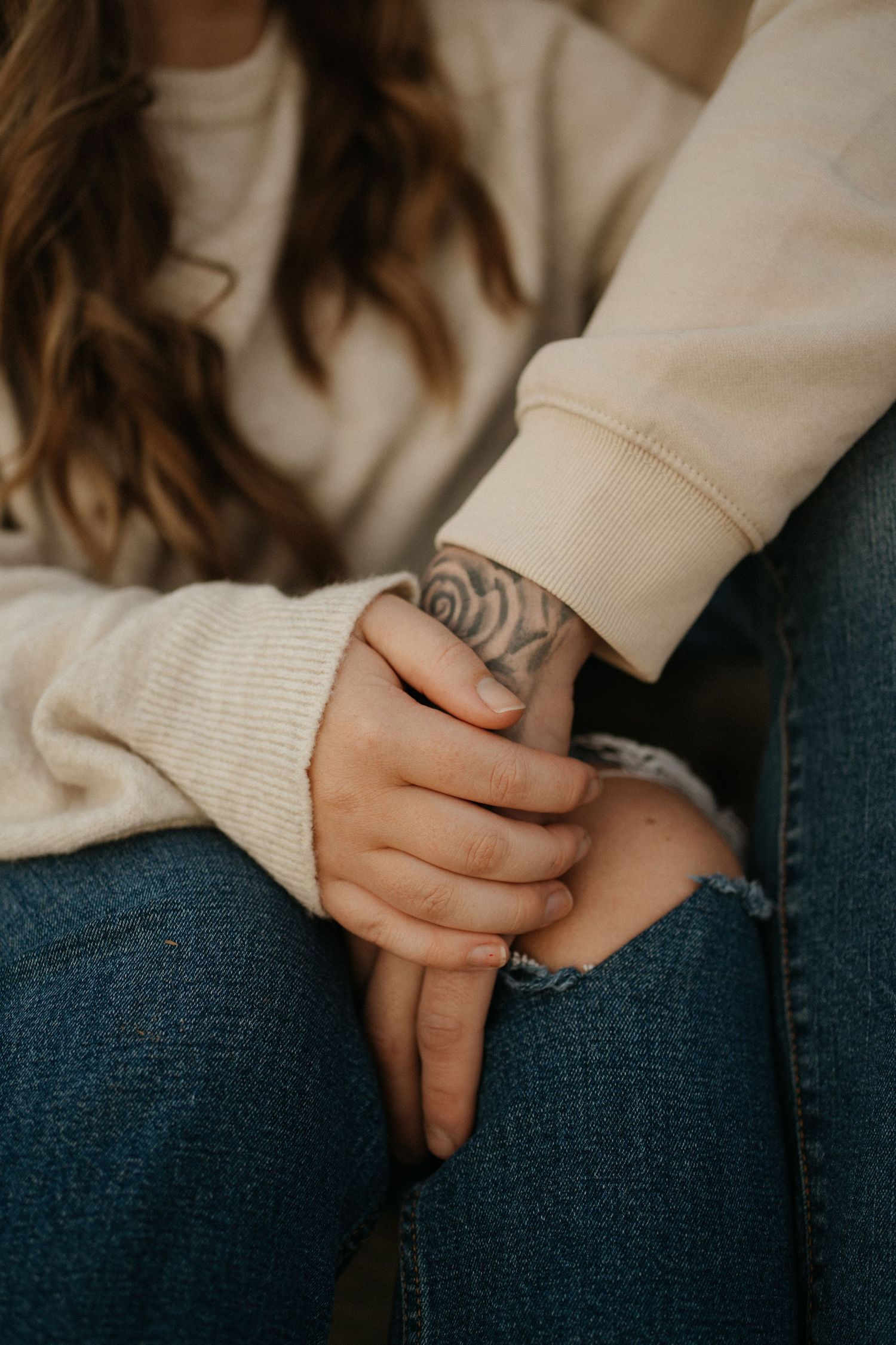 a man and woman hold hands