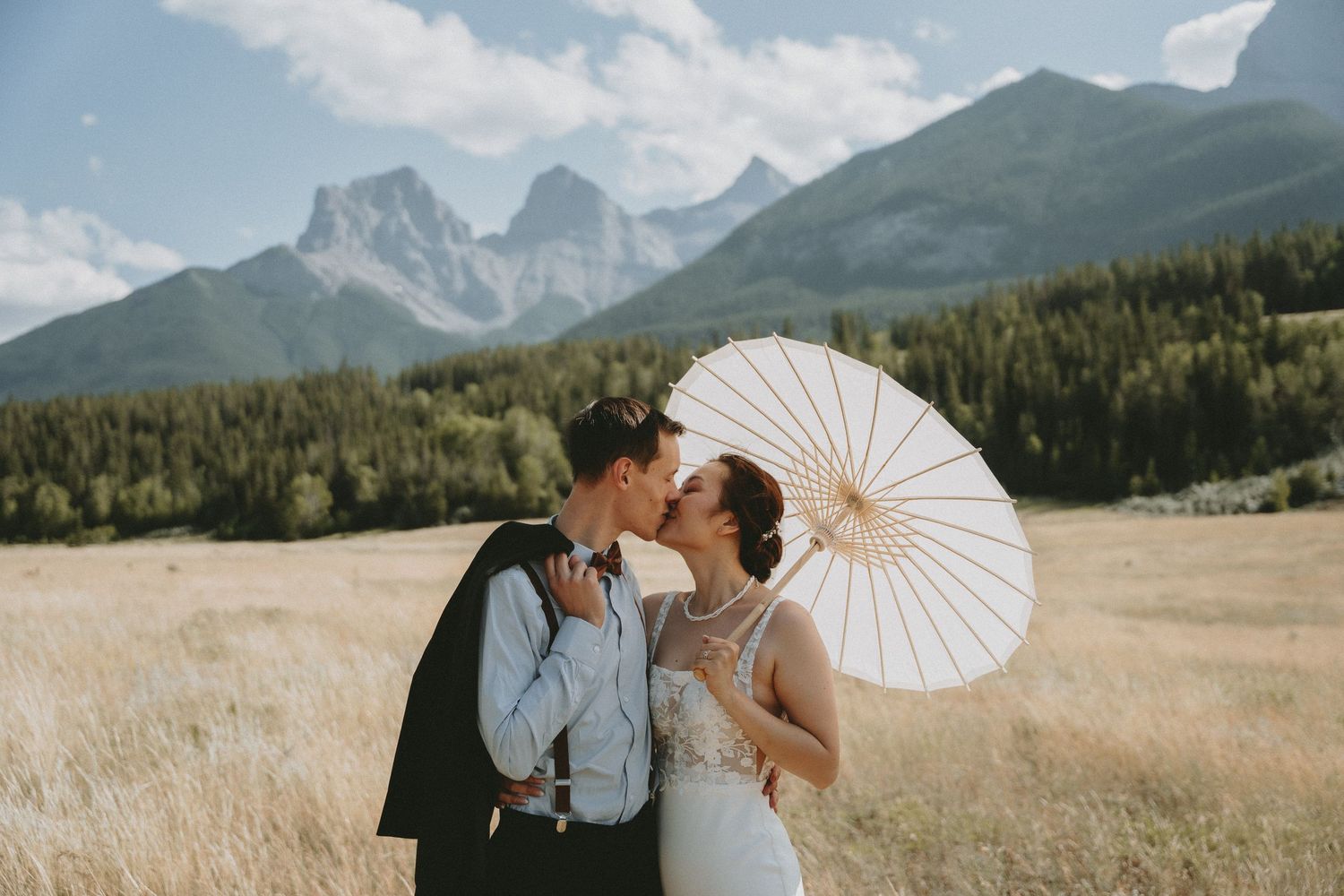 A bride and groom share a kiss in Canmore at their intimate elopement.
