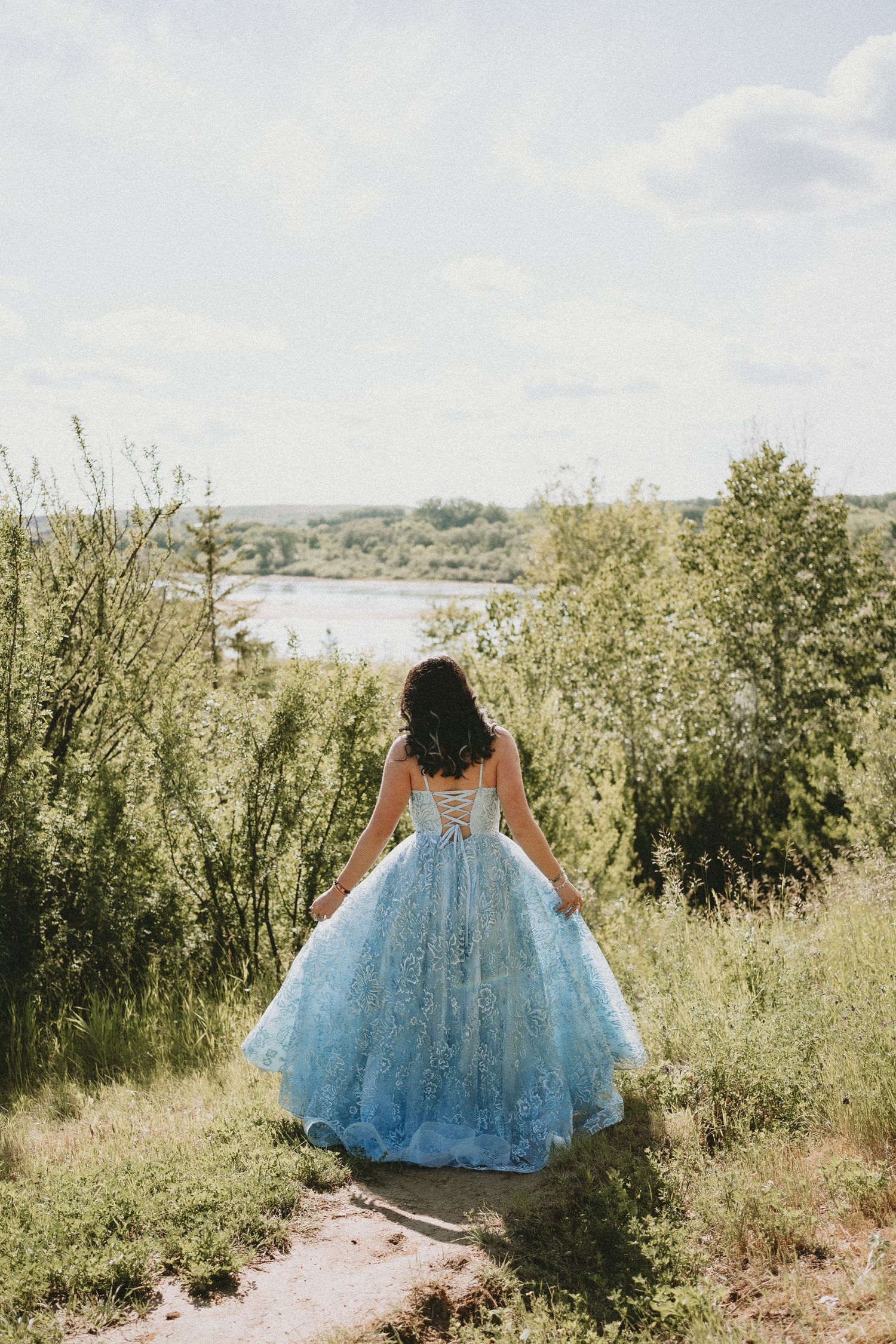 a graduate in a blue dress