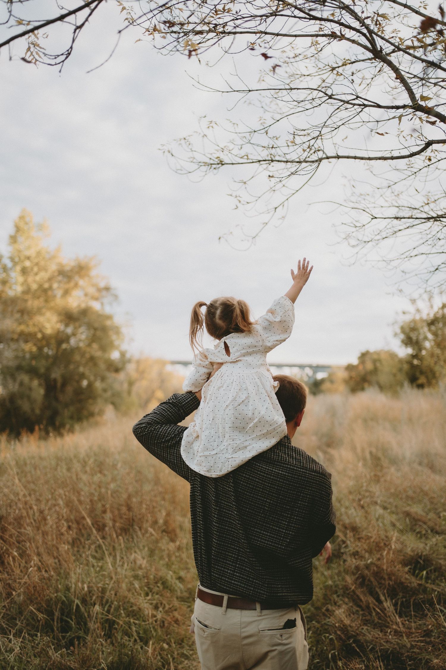 a father holds his daughter