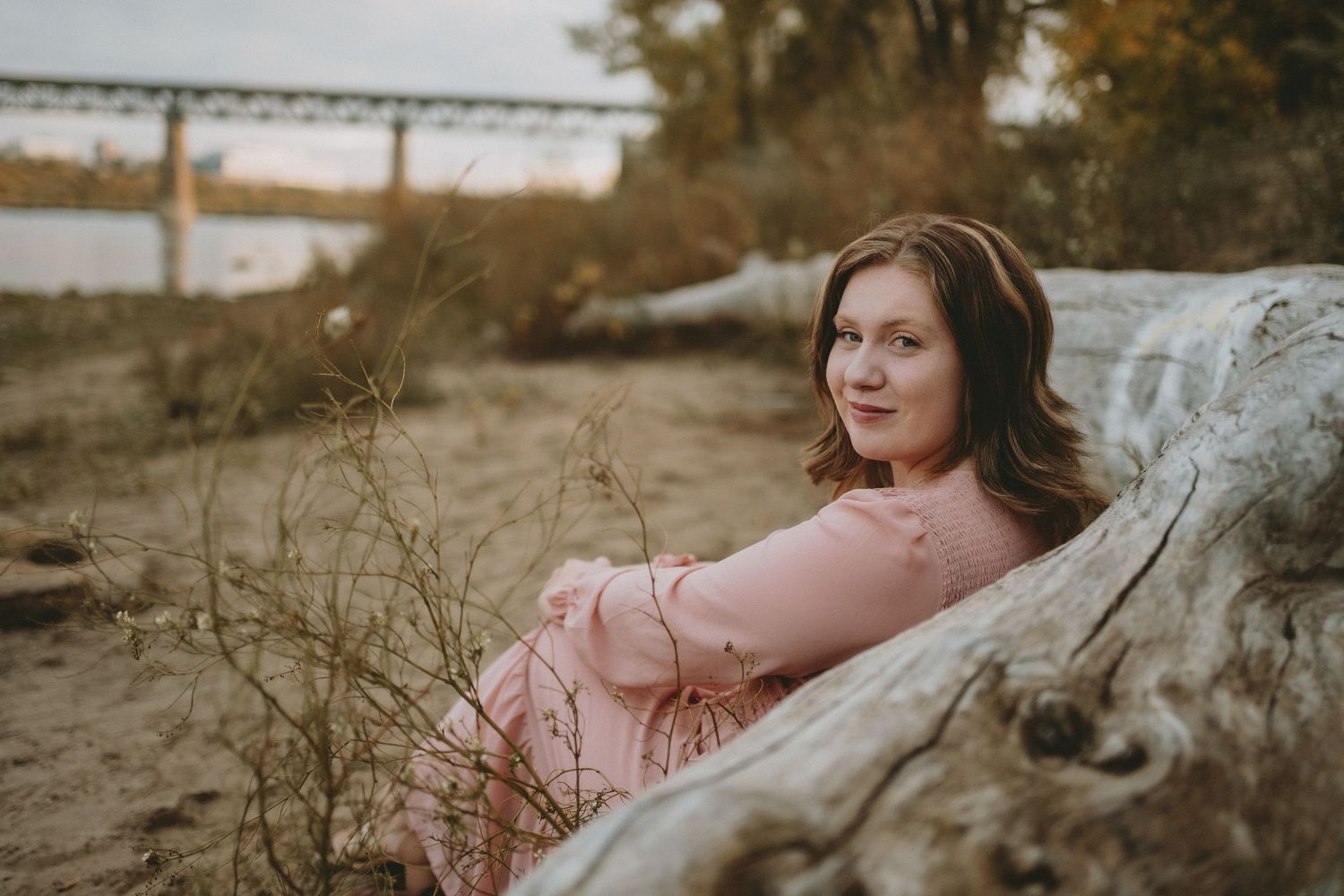 A woman sits on the beach