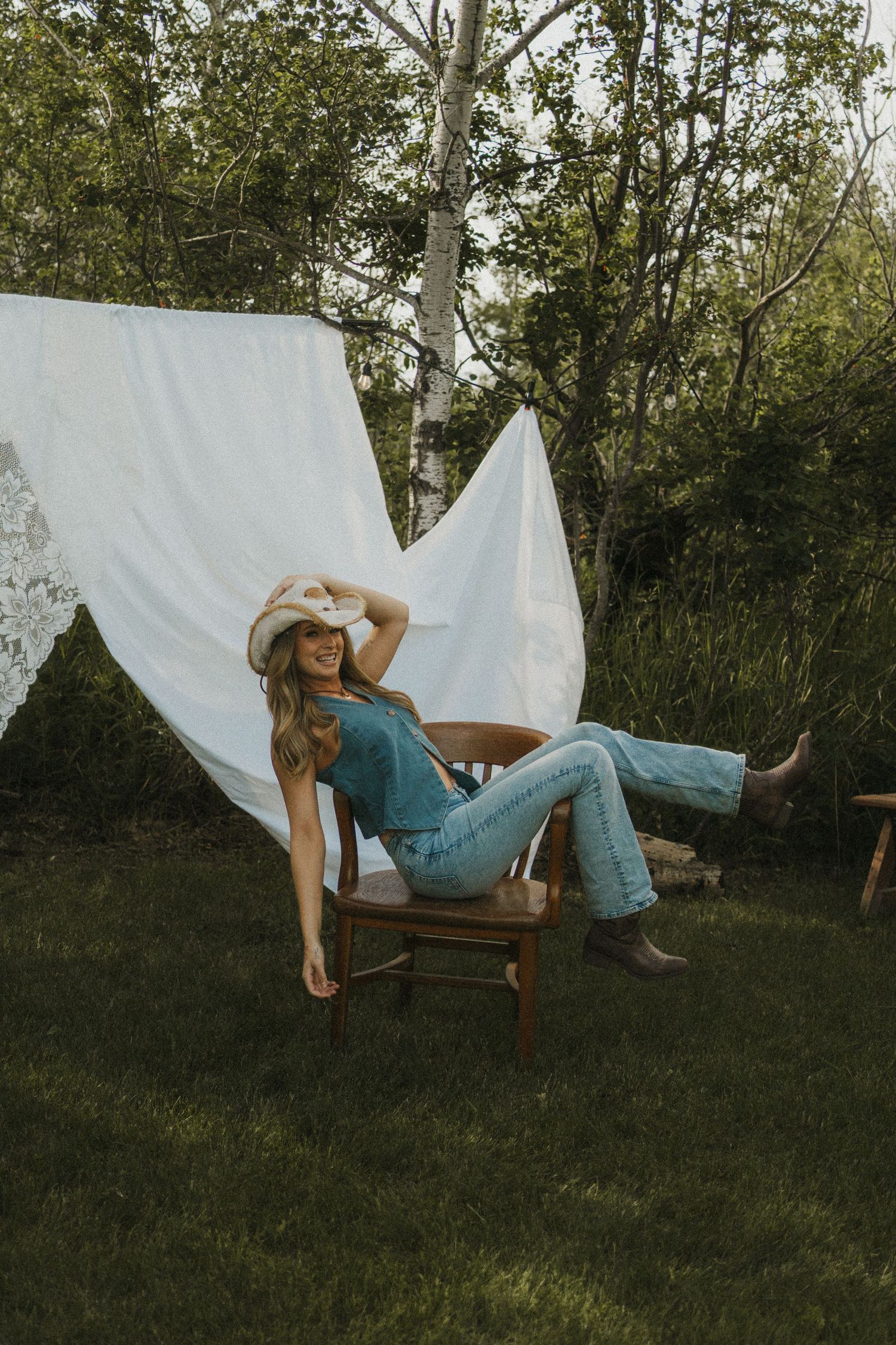 A photo of a woman having fun at a stylized photoshoot. Candid.