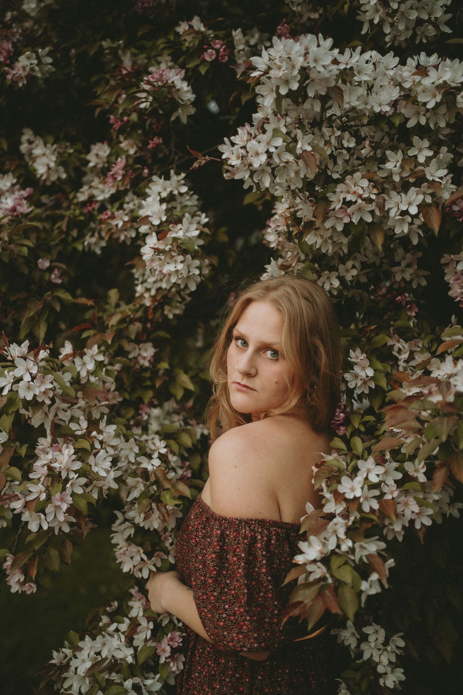 a woman in the blossoms