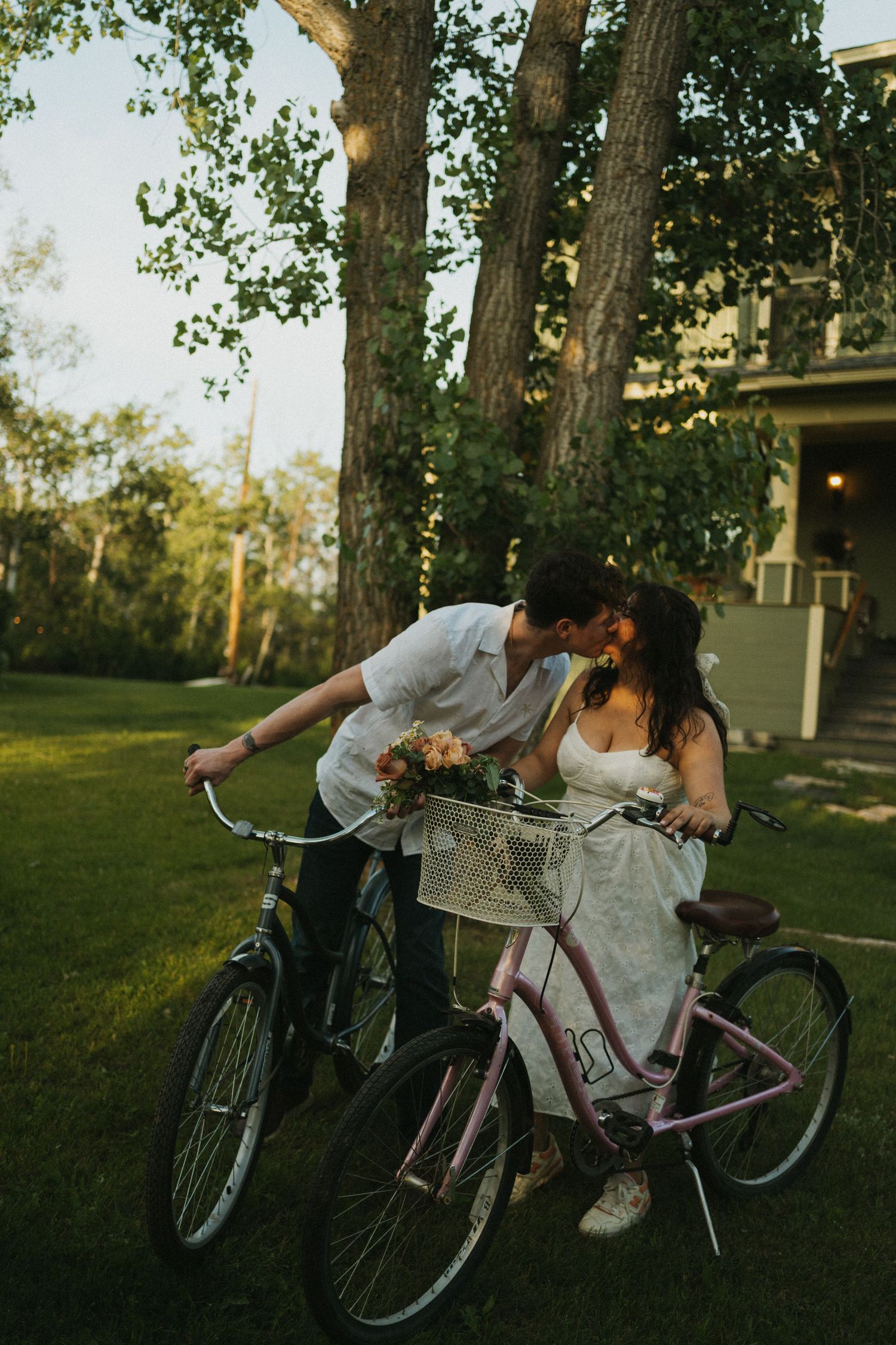 A couple shares a kiss while riding bikes. Candid and Cinematic.