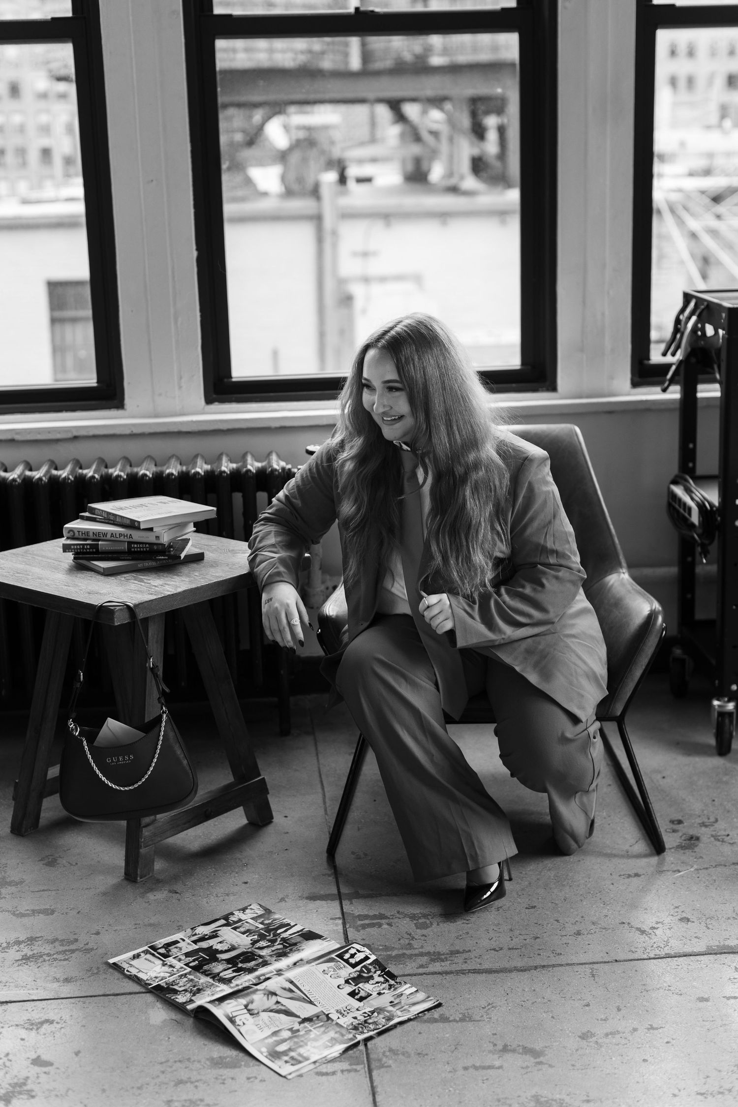 A black and white photo series shows someone reading magazines on the floor in different relaxed positions.
