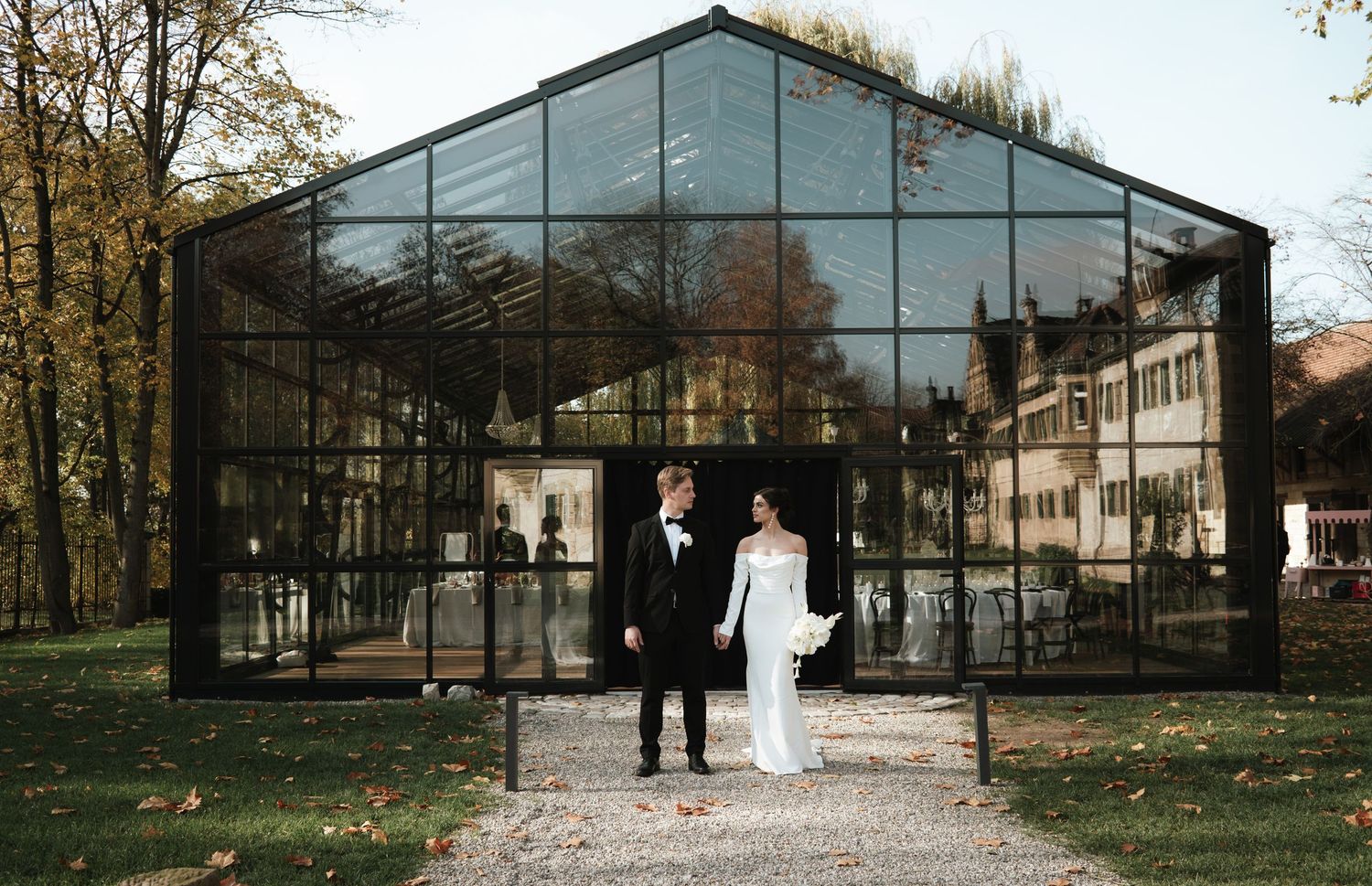 A series of six connected images showing a greenhouse structure and garden path in a wooded setting during autumn.