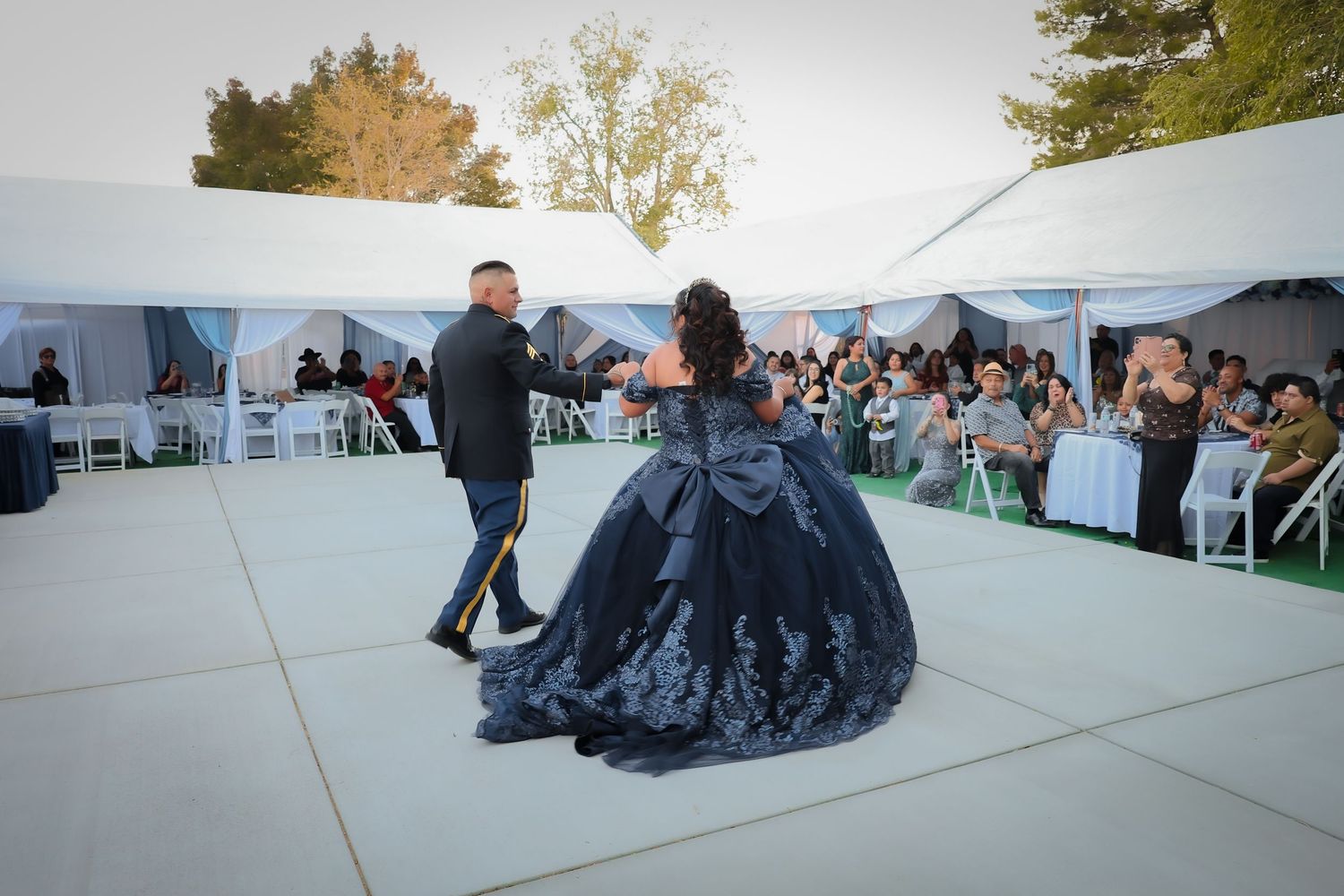 Grand entrance of the birthday girl led out hand in hand with her father wearing his dress blues.