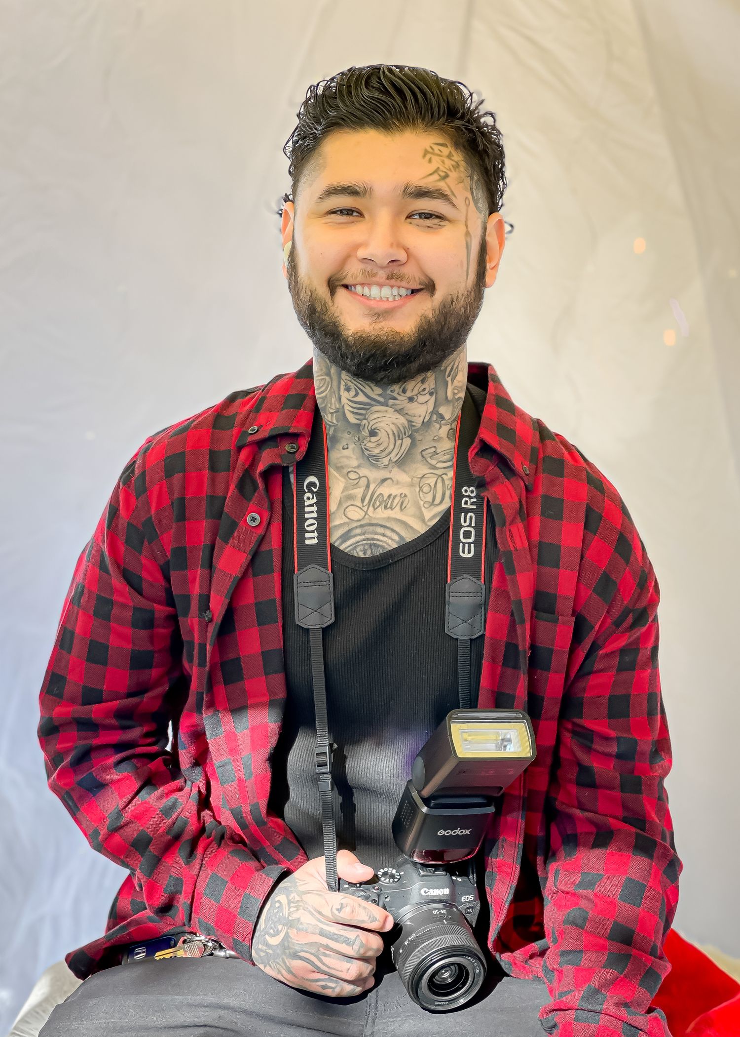 Elias, co-owner of 818 Films Photography, smiling confidently.