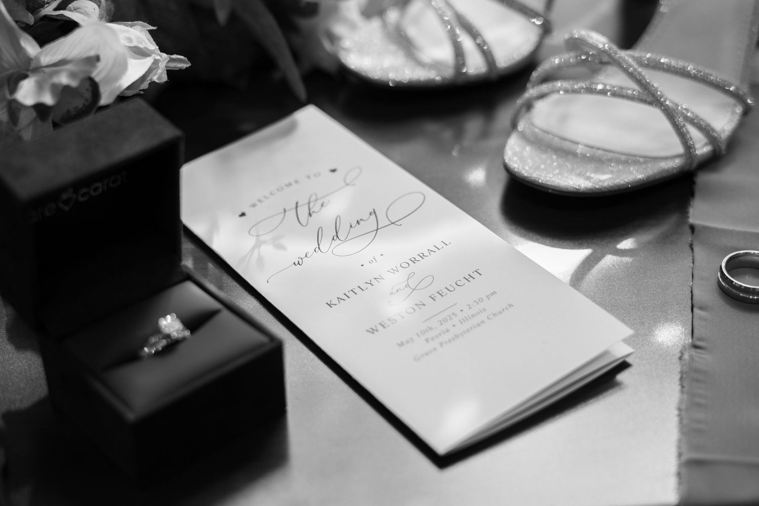 Black and white detail shots of wedding documents and decorative items.