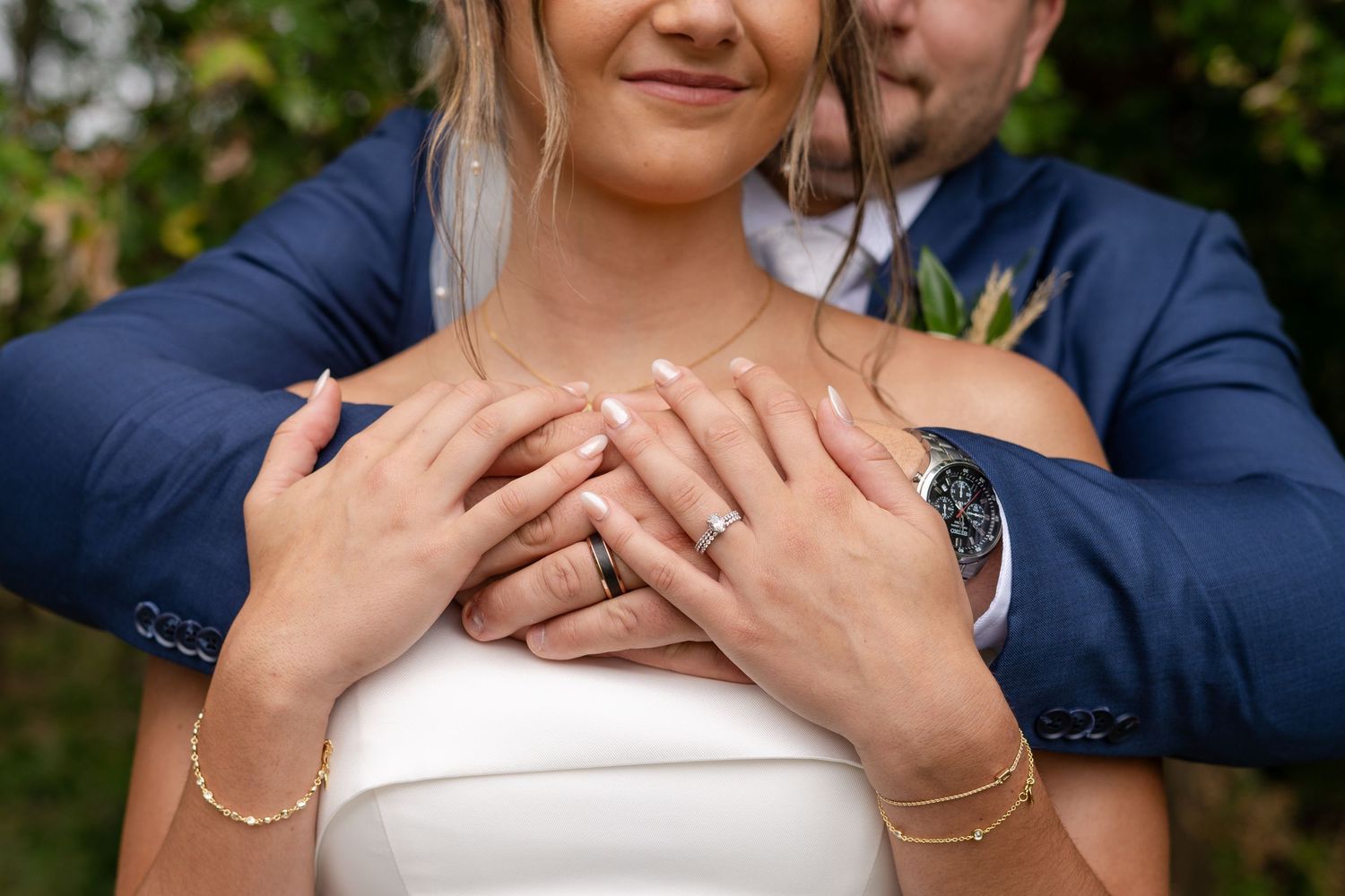 Intimate close-up shots of couple embracing in garden setting.
