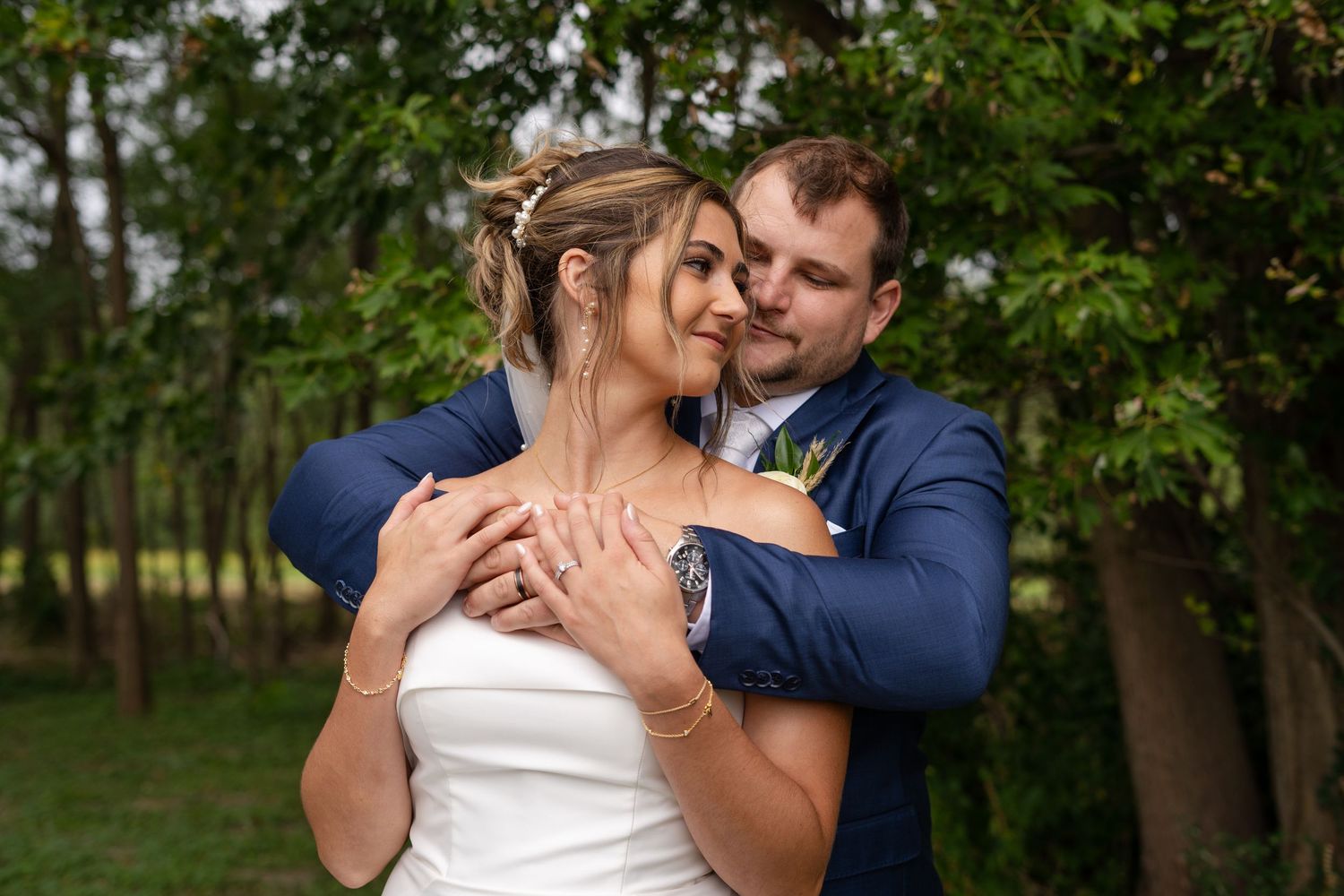Romantic outdoor wedding portraits showing tender moments between newlyweds.
