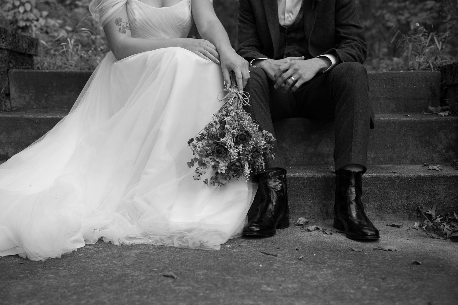 Black and white wedding photos showing couples' feet and formal attire details.