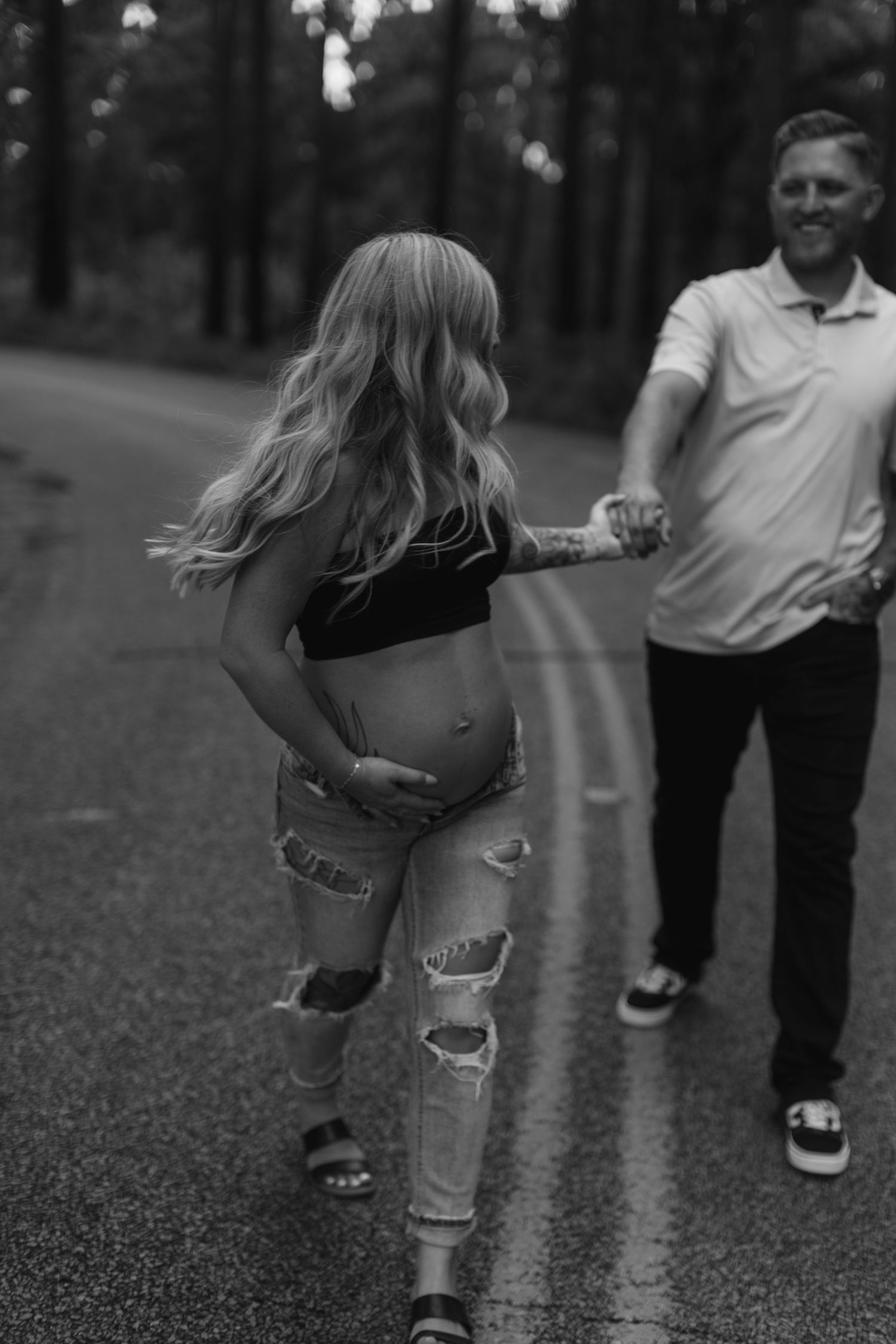 Black and white photo sequence shows someone in ripped jeans walking across pavement while playing with a ball.