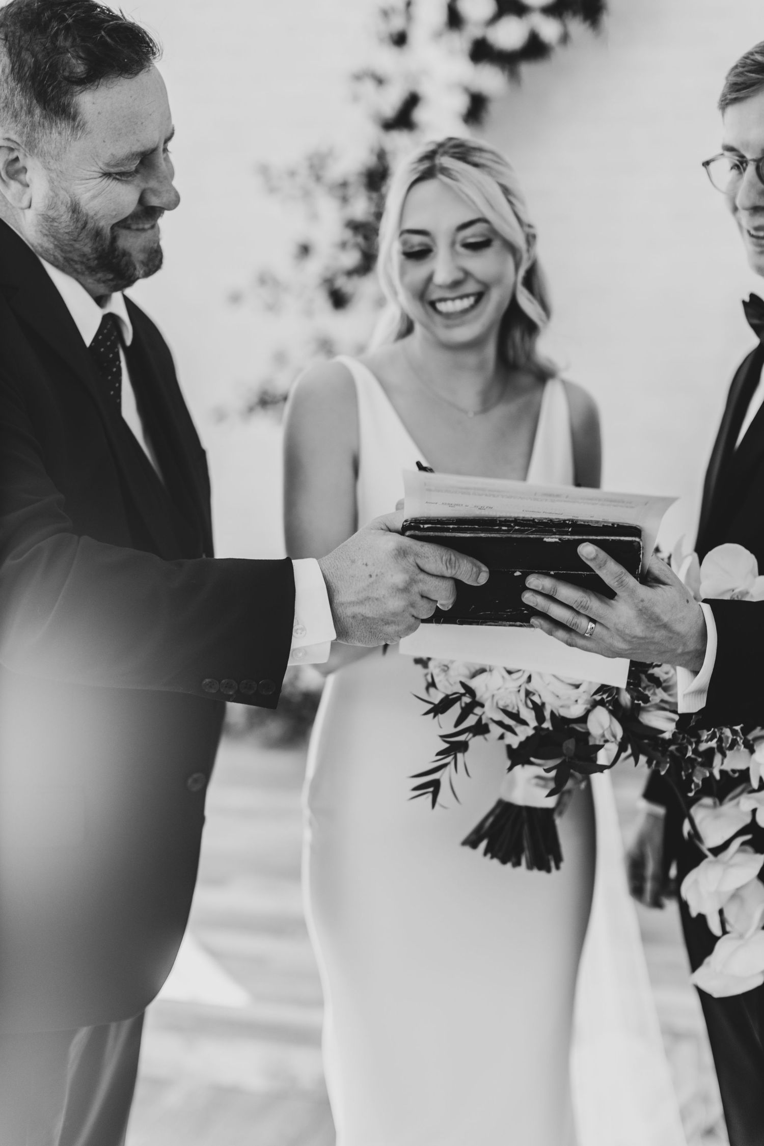 Black and white candid wedding photos capture joyful moments during ceremony.
