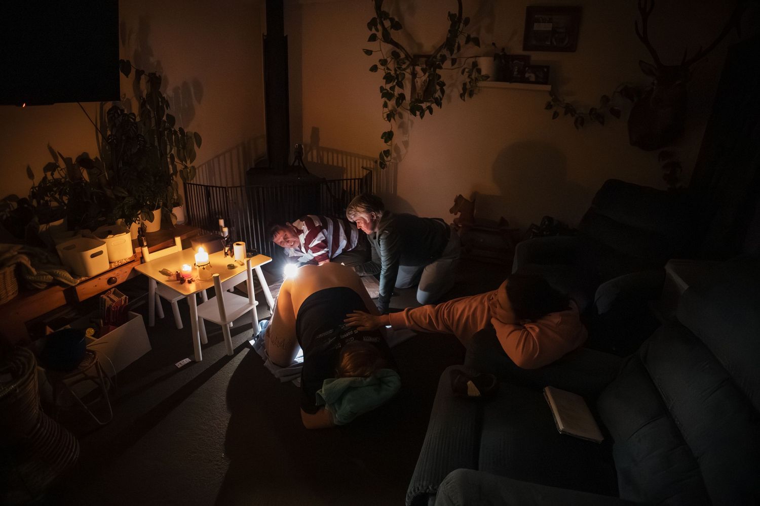 A series of dark, moody photos showing various dimly lit indoor scenes with silhouettes and shadows.
