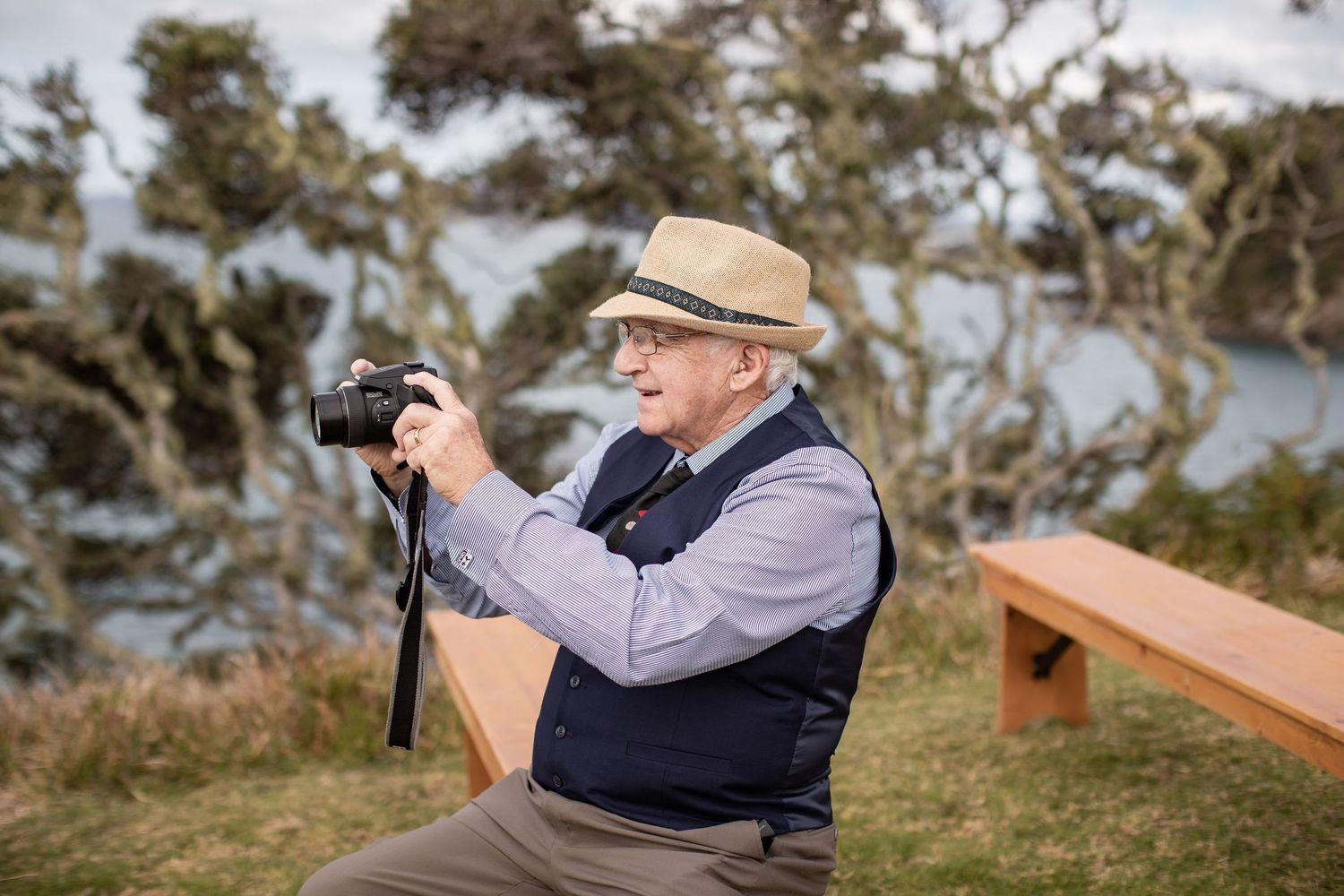 A series of photos showing a photographer with binoculars observing birds in a coastal outdoor setting.