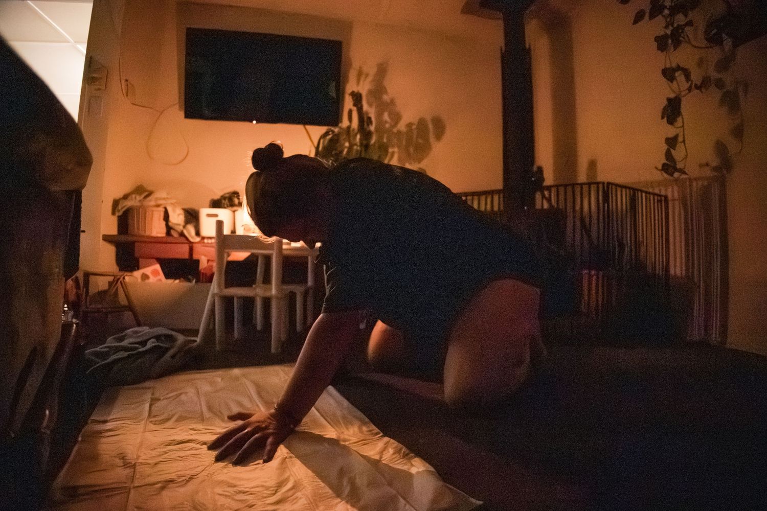 Medical professionals in dim lighting working intently during a nighttime procedure.
