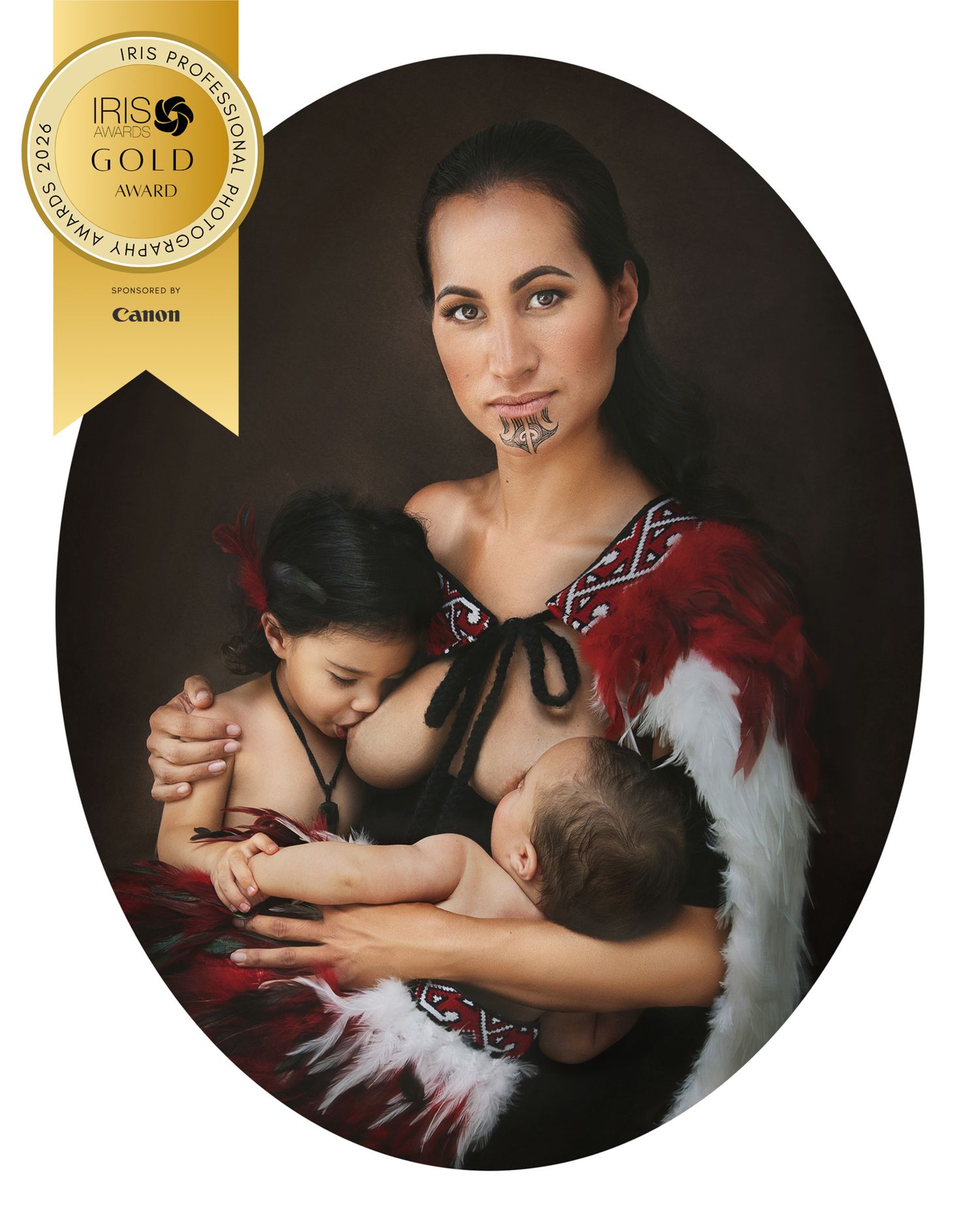 Award-winning portrait of a Maori woman in traditional dress tandem breastfeeding two children, IRIS Gold Award winner.