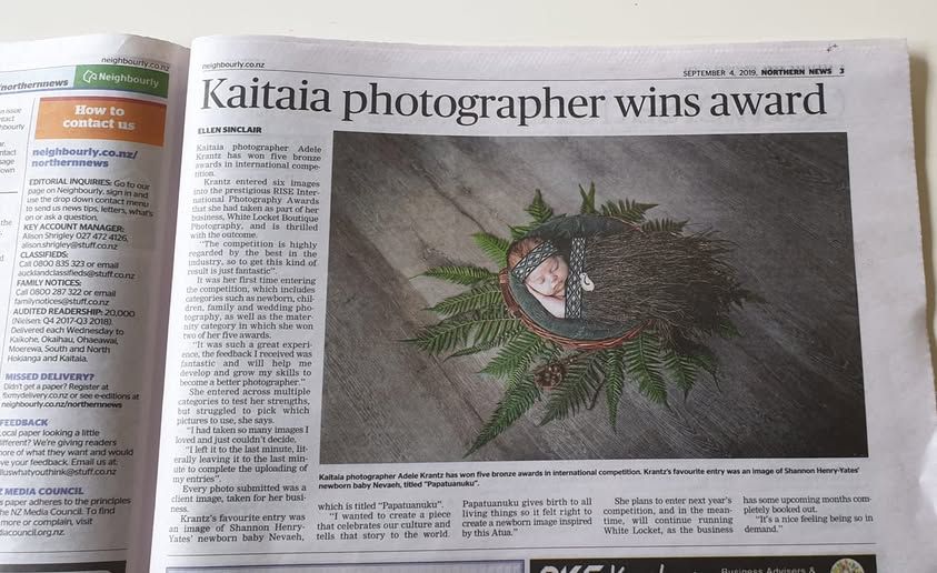 A newspaper article about a Kaitaia photographer winning an award, showing an artistic photo print in black and white.