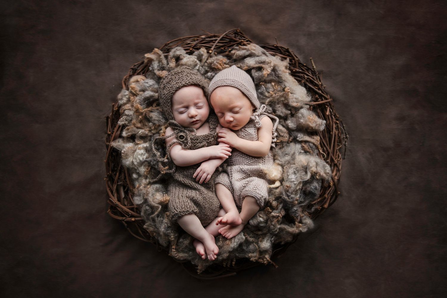 Twin newborn babies sleeping together in rustic nest with soft neutral tones. Cambridge Waikato NZ Photographer. White Locket Photography