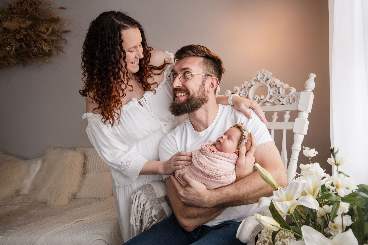 A collection of intimate family moments captured in soft lighting with a newborn baby in a cozy home setting.