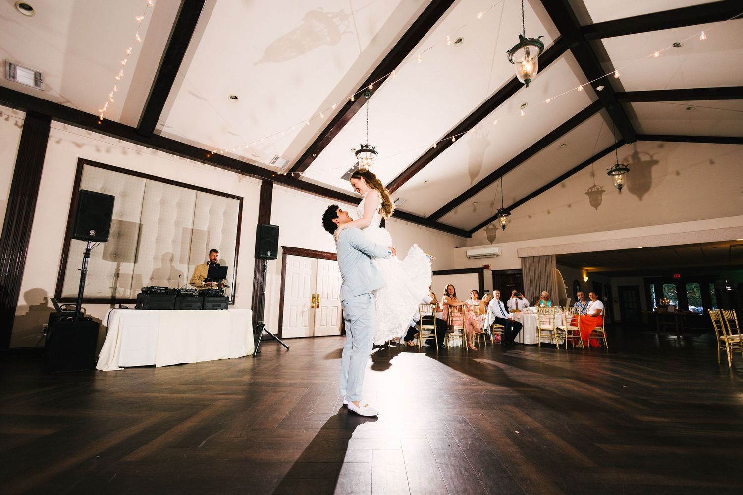 A sequence of five wedding photos showing a dance floor with guests celebrating at a reception.