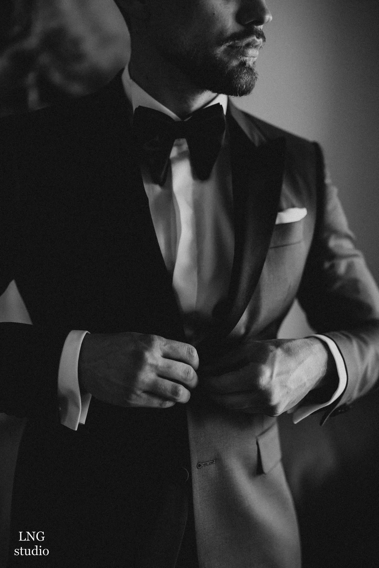 Black and white fashion photo series showing details of men's formal attire and bow ties in dramatic lighting.