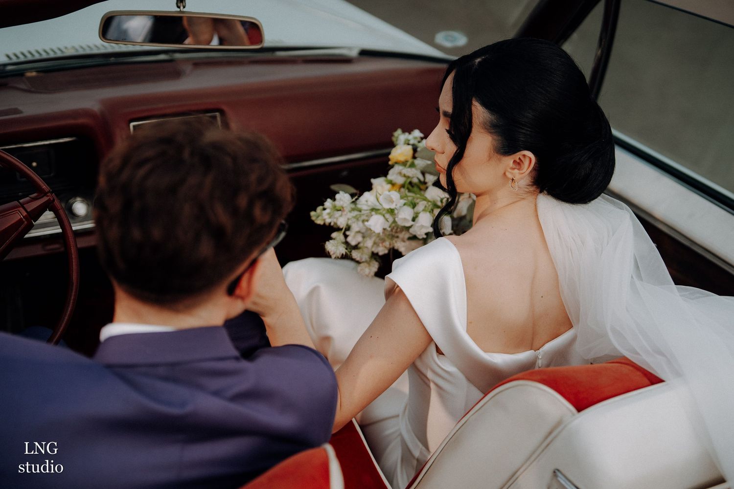 A sequence of candid car interior moments shows a person holding a white bouquet during what appears to be a wedding day.