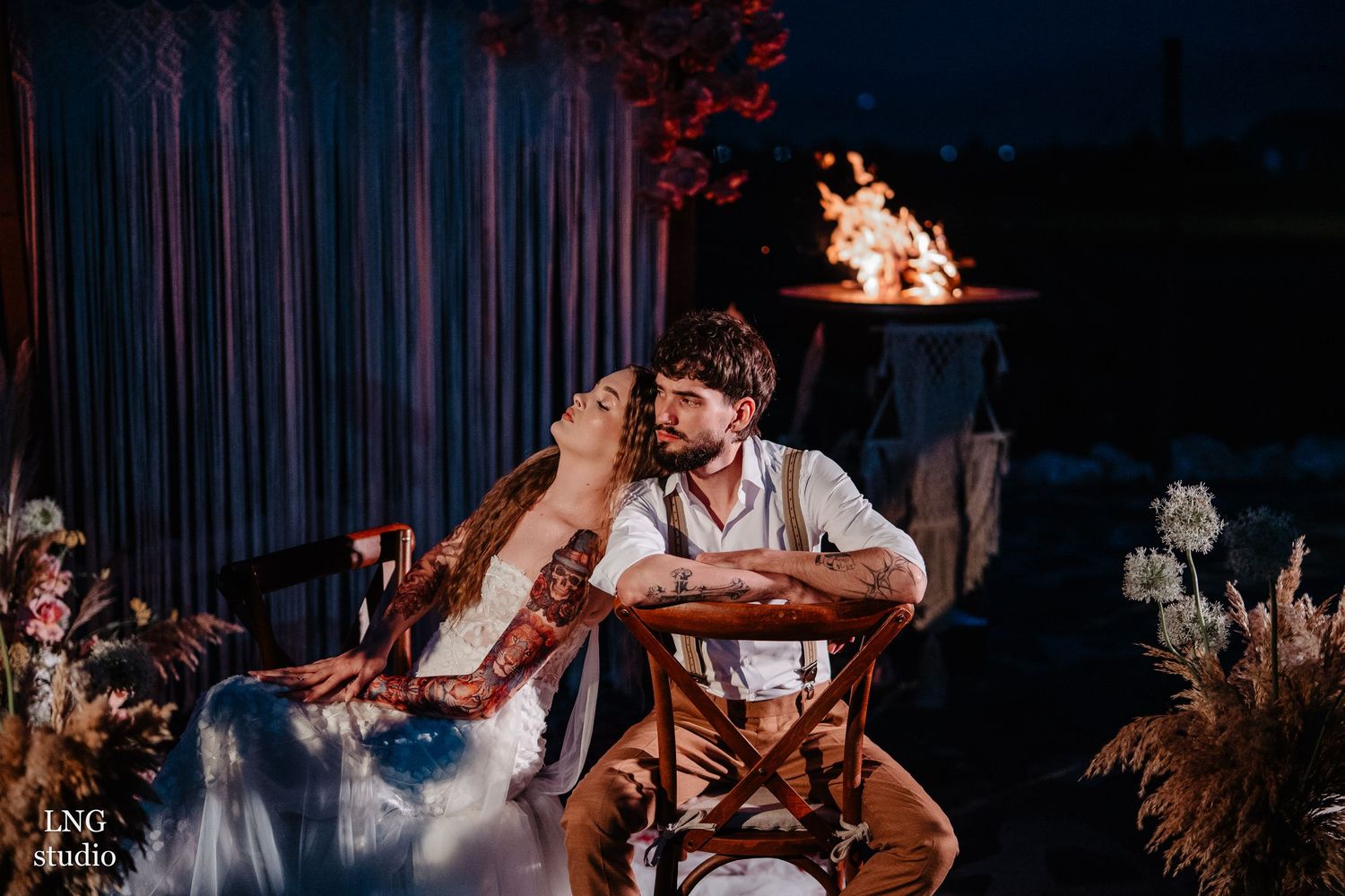 Wedding couple sharing intimate slow dance moments on a dimly lit dance floor during their reception.